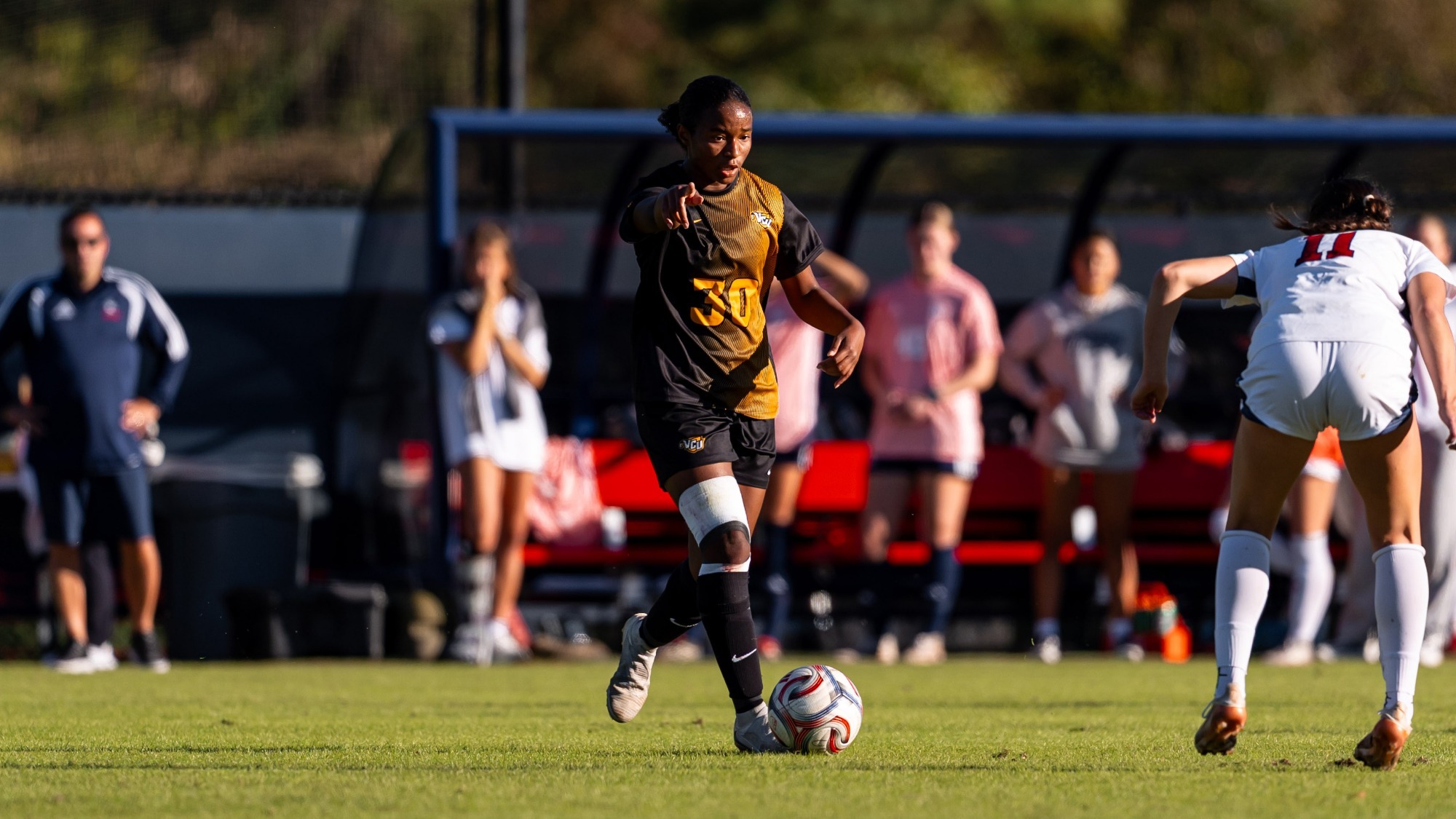 Monique McEnhimer dribbles vs. Richmond