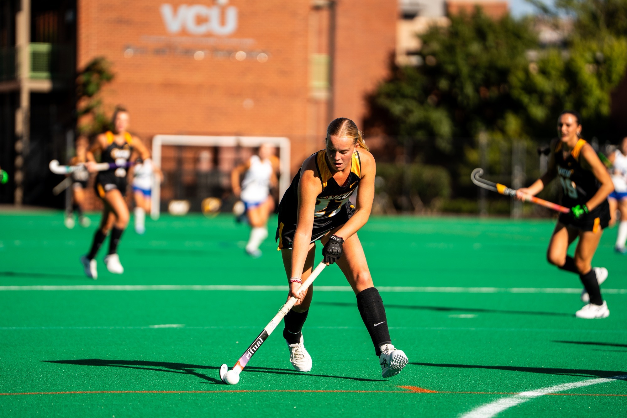 Julia Spohr of VCU dribbles the ball wearing a black uniform unguarded in a game against Saint Louis