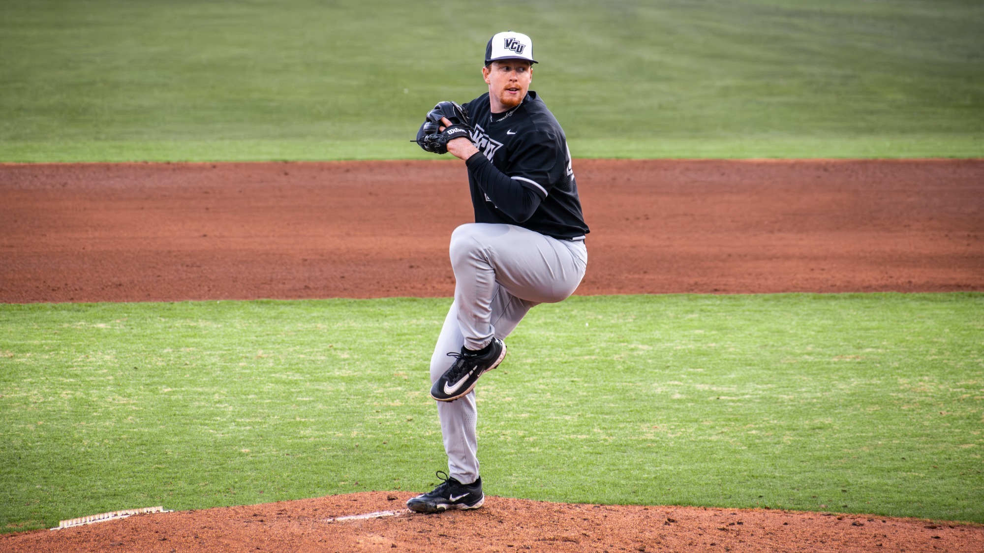 Elias Holbert pitches at Virginia