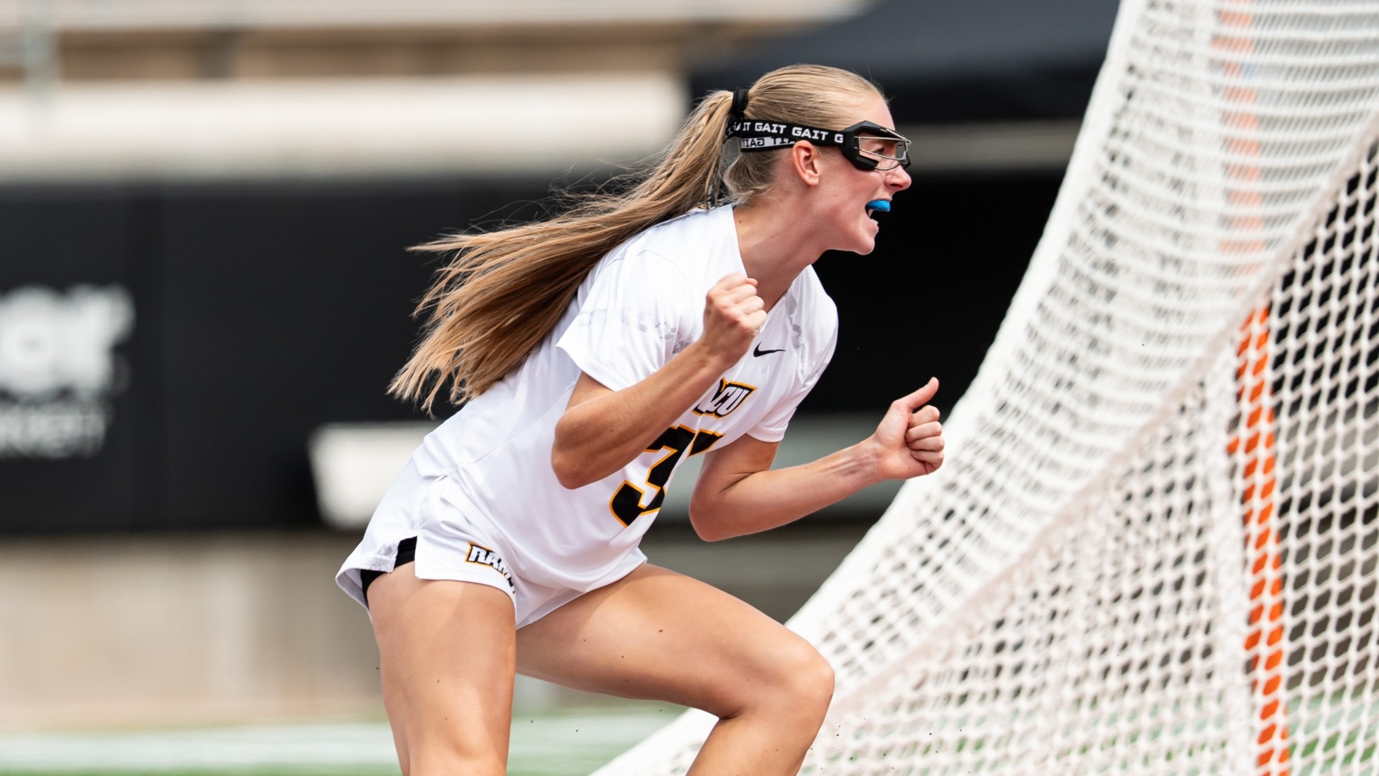 Sam Palmer of VCU Lacrosse yells and clinches her fists after scoring a goal in the A-10 Semifinals against St. Bonaventure