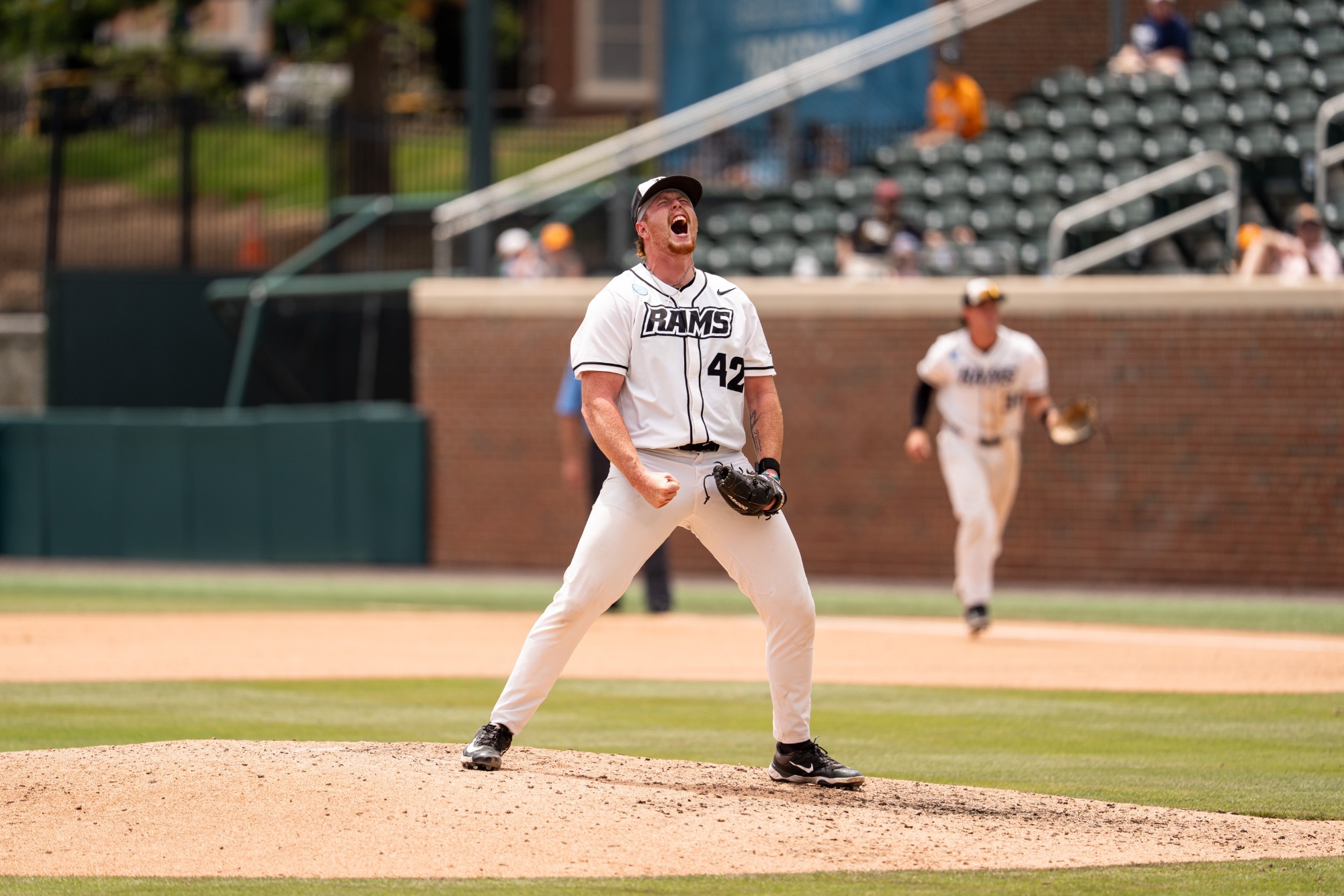 Eli Holbert celebrates on the mound vs. #23 Tennessee in NCAA Chapel Hill Regional