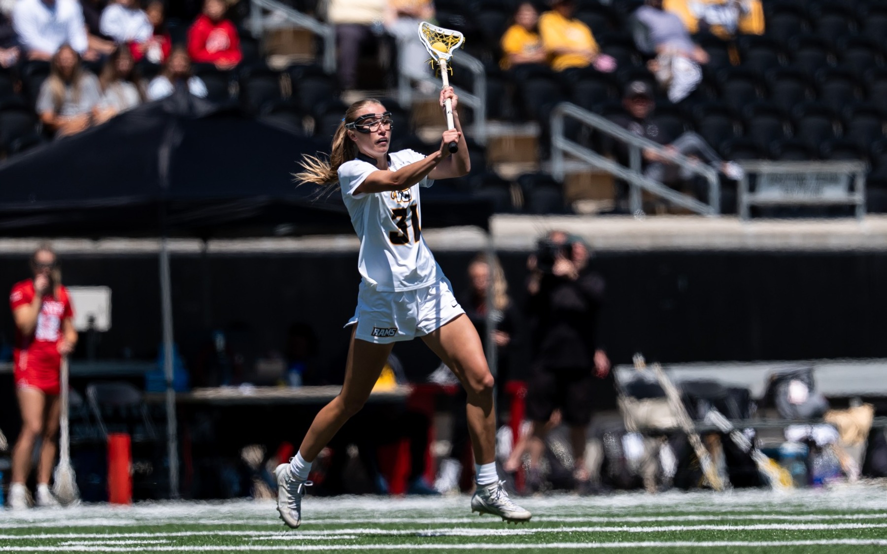 Kiley Kozak of VCU wearing a white #31 jersey passes the ball unguarded in the A-10 Championship game against Davidson