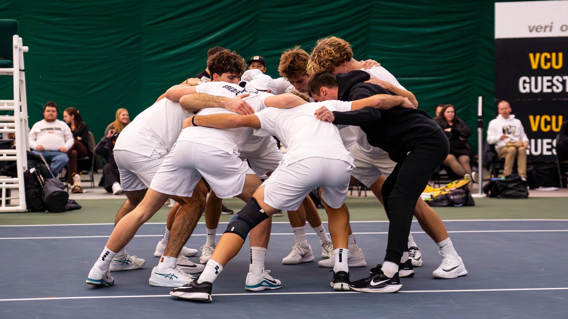 Men's Tennis huddle 2026