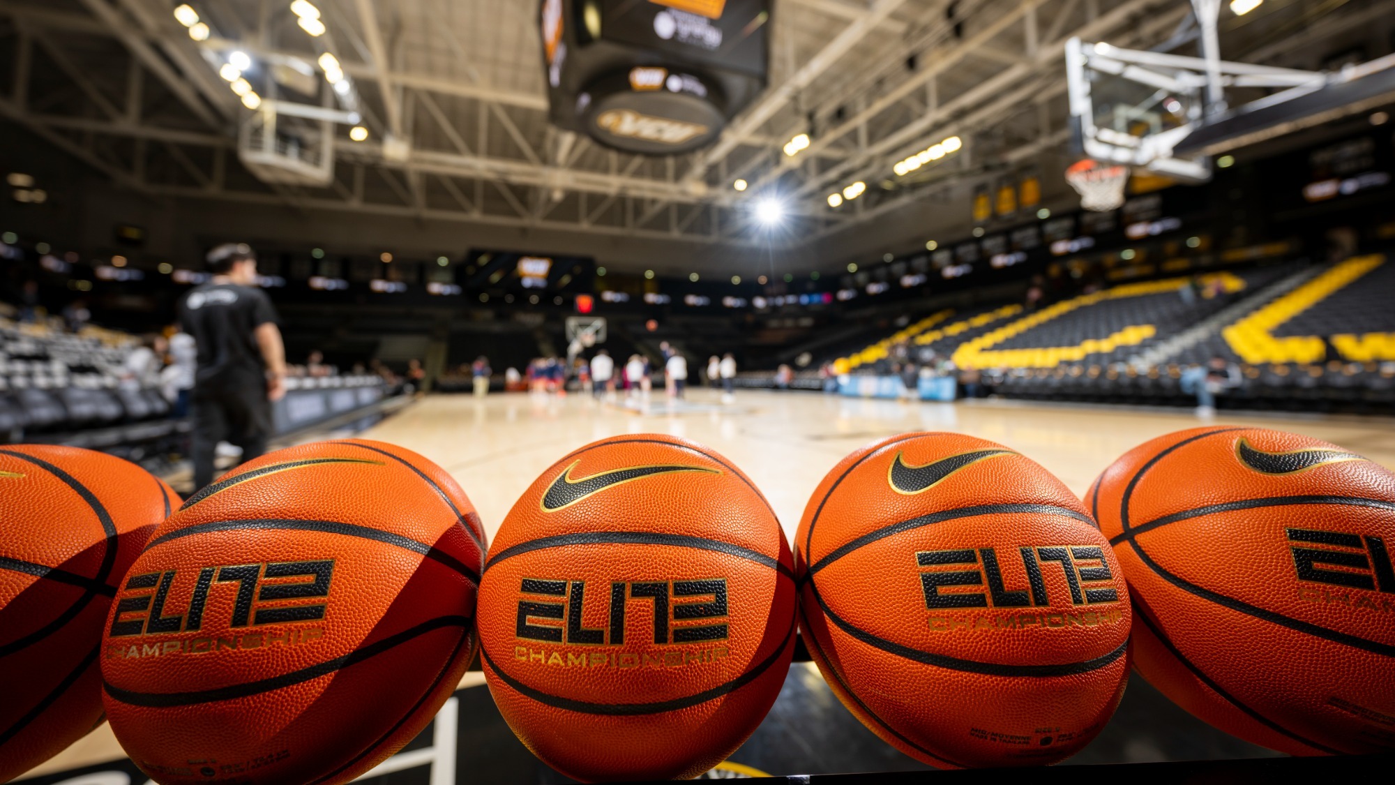 A rack of Nike Women's Basketballs in the foreground with the Siegel Center blurred in the background