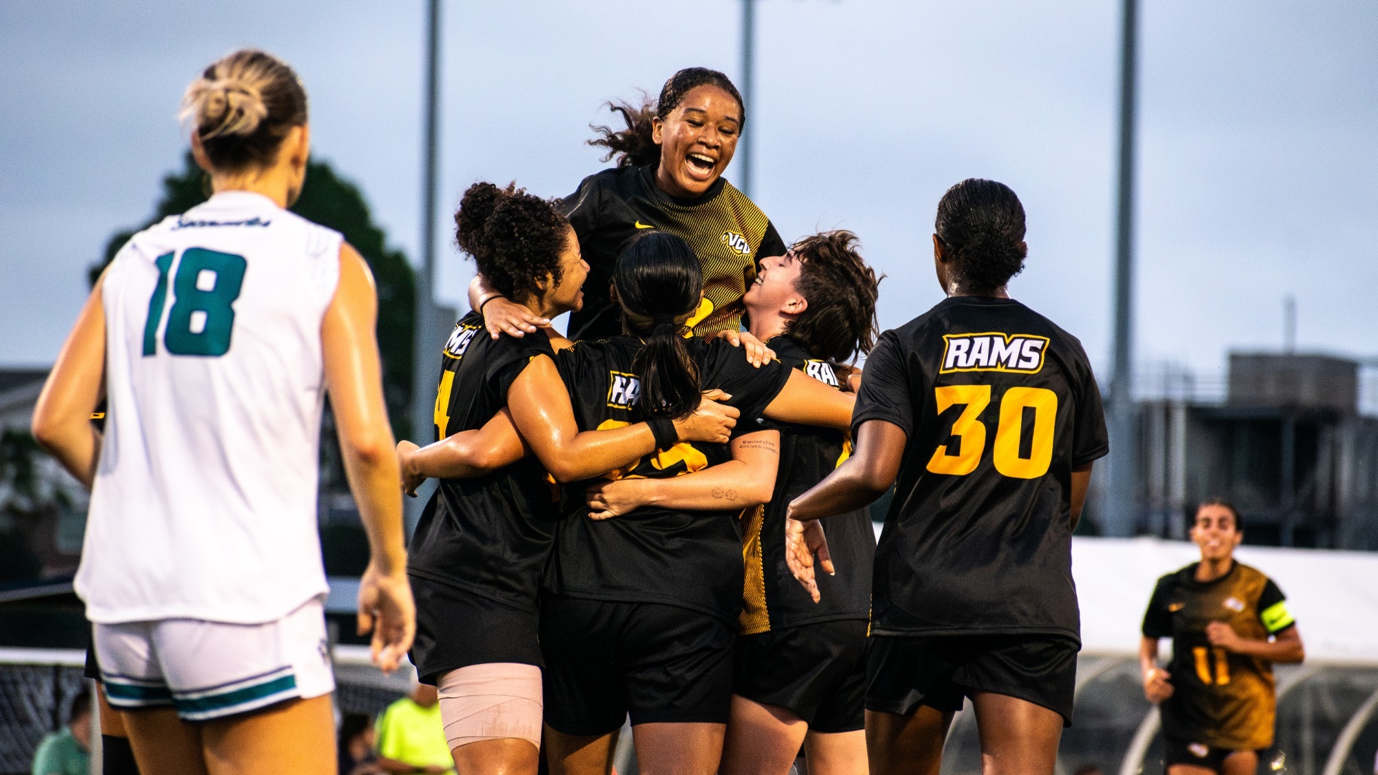 Jayla Walton celebrates Shiori Shintaku goal at UNCW
