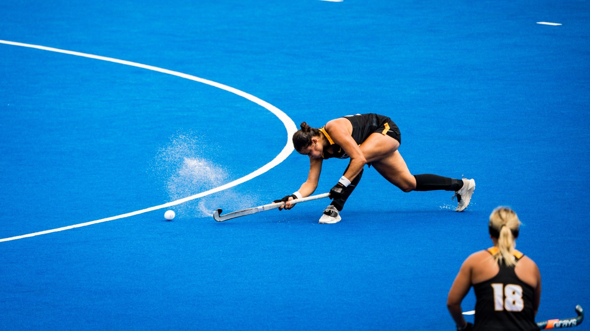 Ana Afonso of VCU wearing a black uniform sweeps a pass in a game at Duke