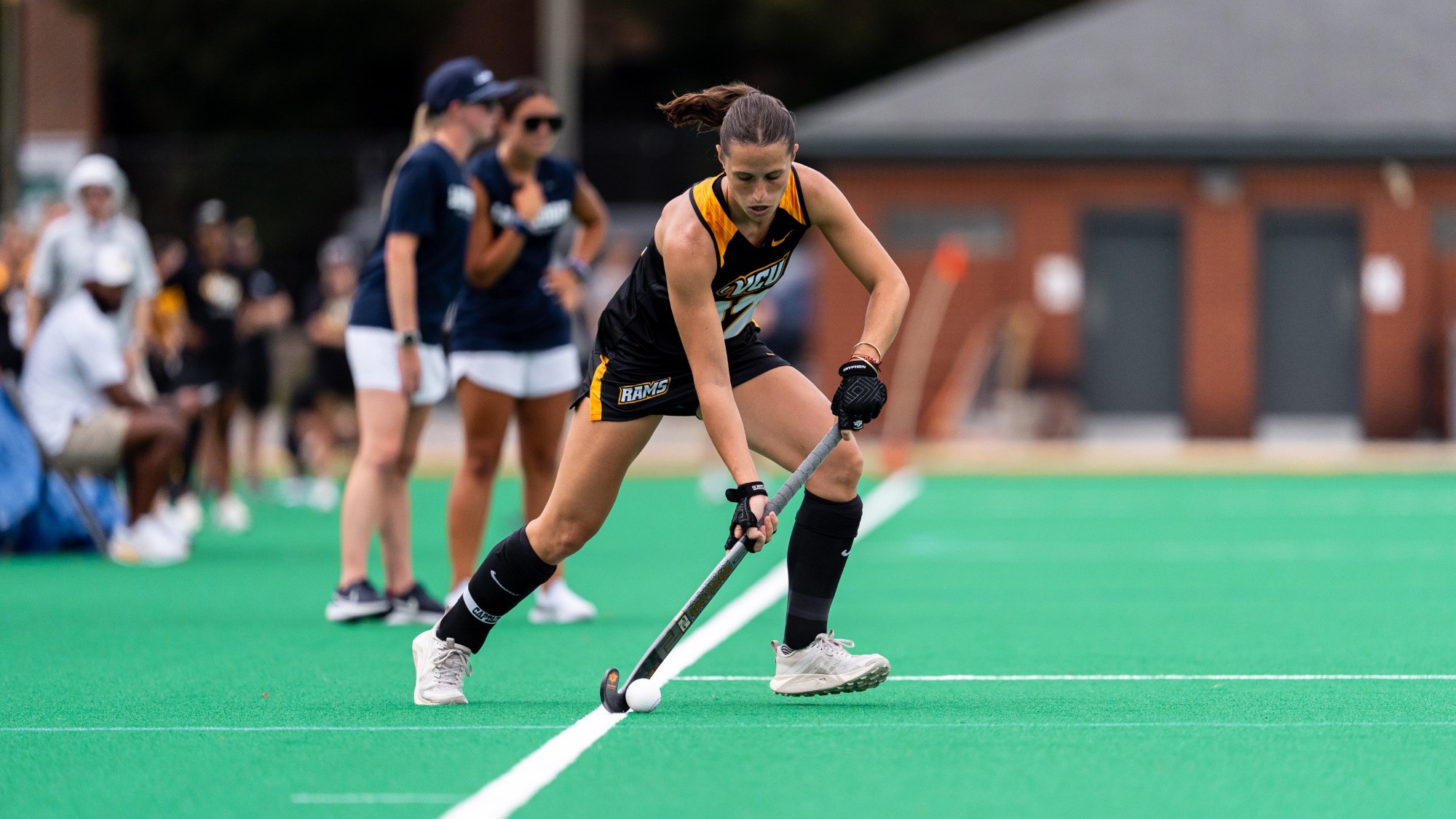 Josefina Ventimiglia of VCU wearing a black #12 jersey readies to play a pass against Longwood