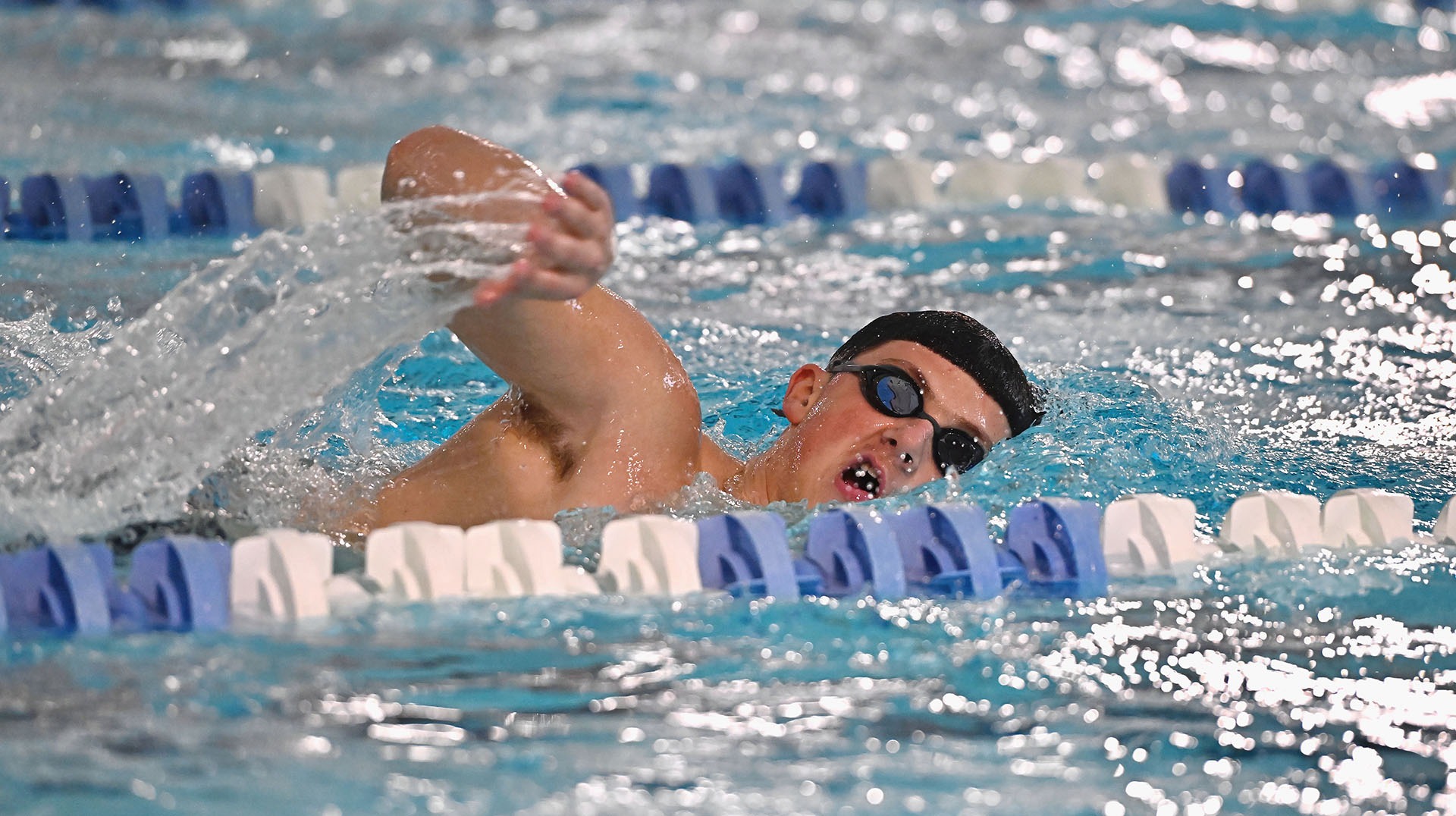 Lawrence men's swimming action Will Phillips