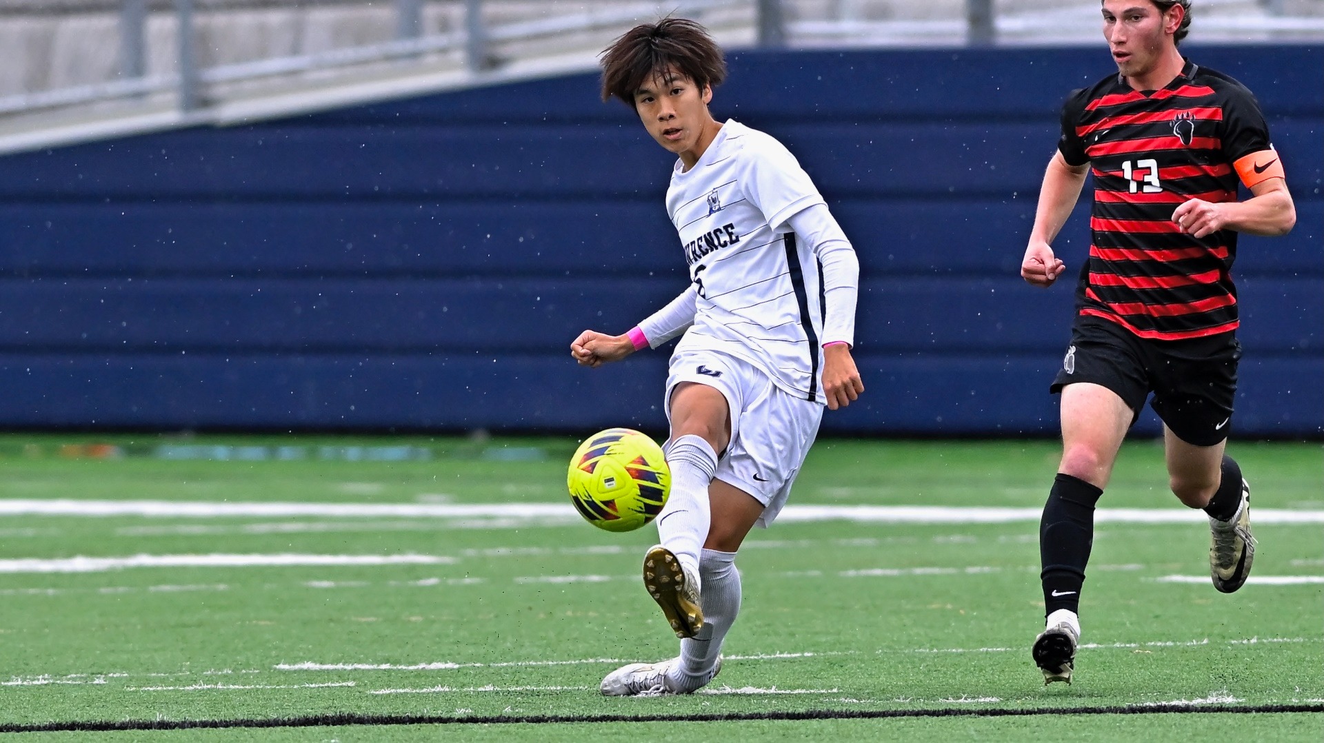 Lawrence men's soccer action Daito Sho