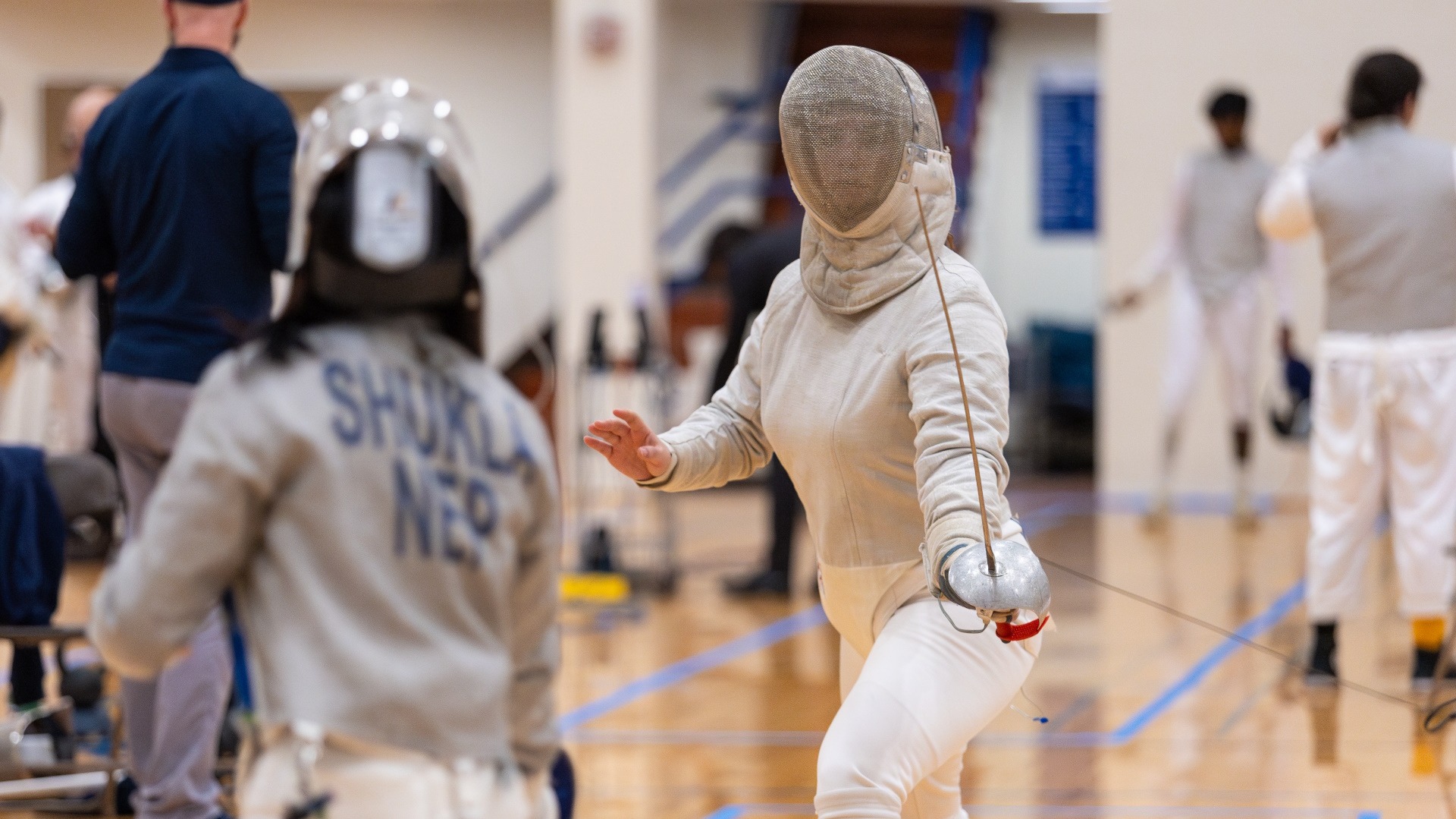 Lawrence women's fencing action