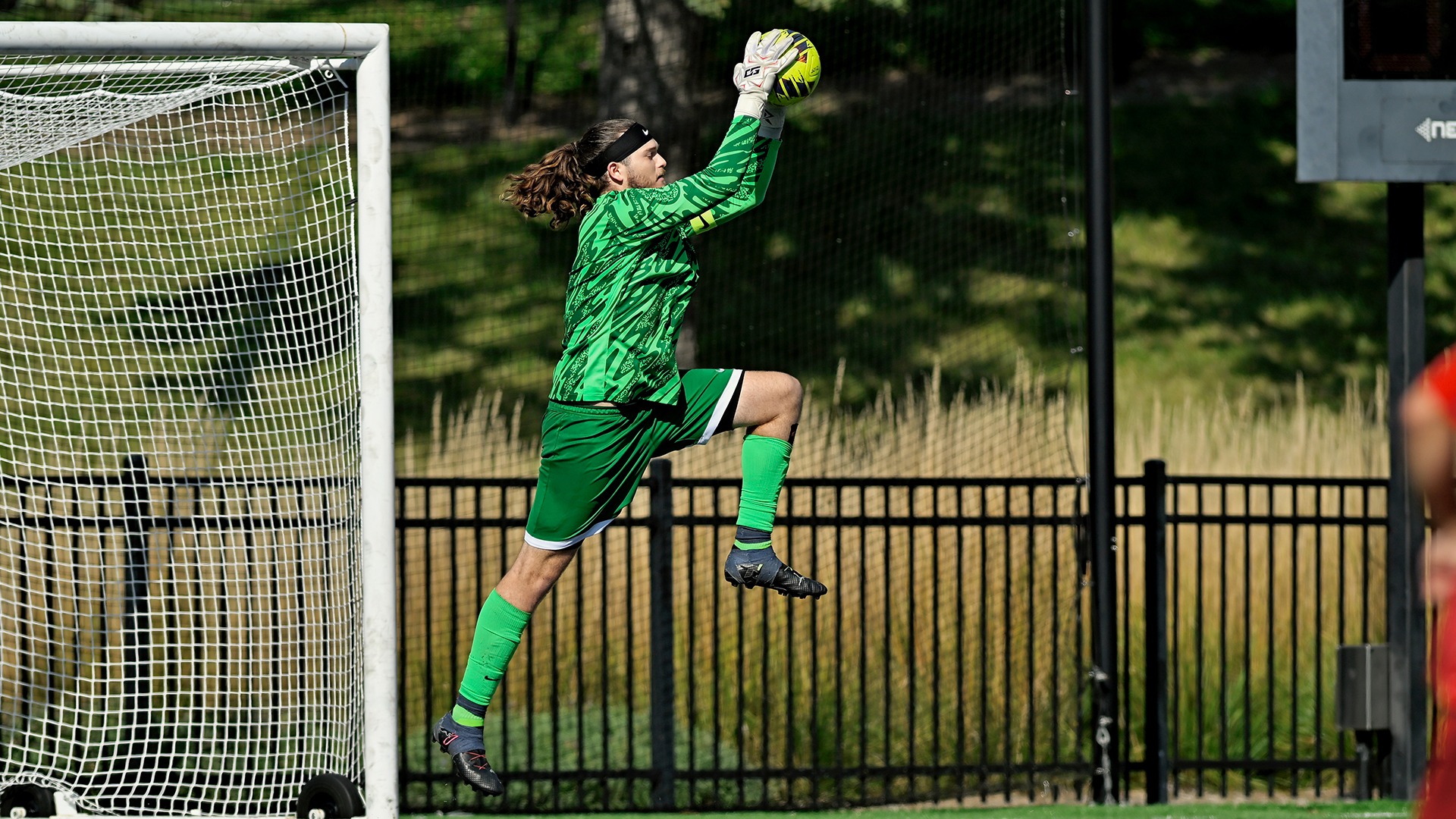 Lawrence men's soccer action Nason Lancina