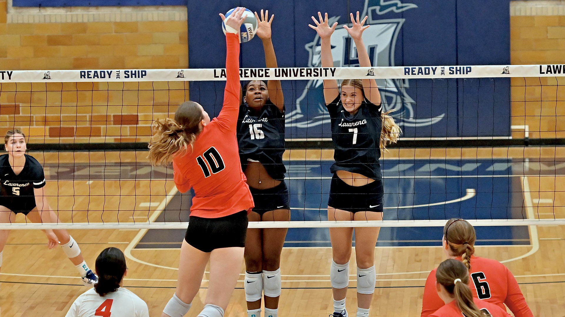 Lawrence volleyball action Chania Tinch and Annaliesse Schmall
