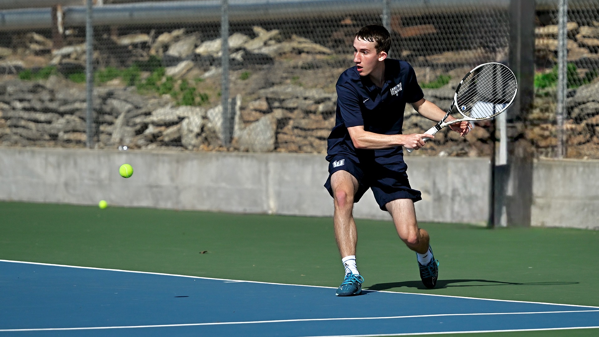 Lawrence men's tennis action Owen Horton