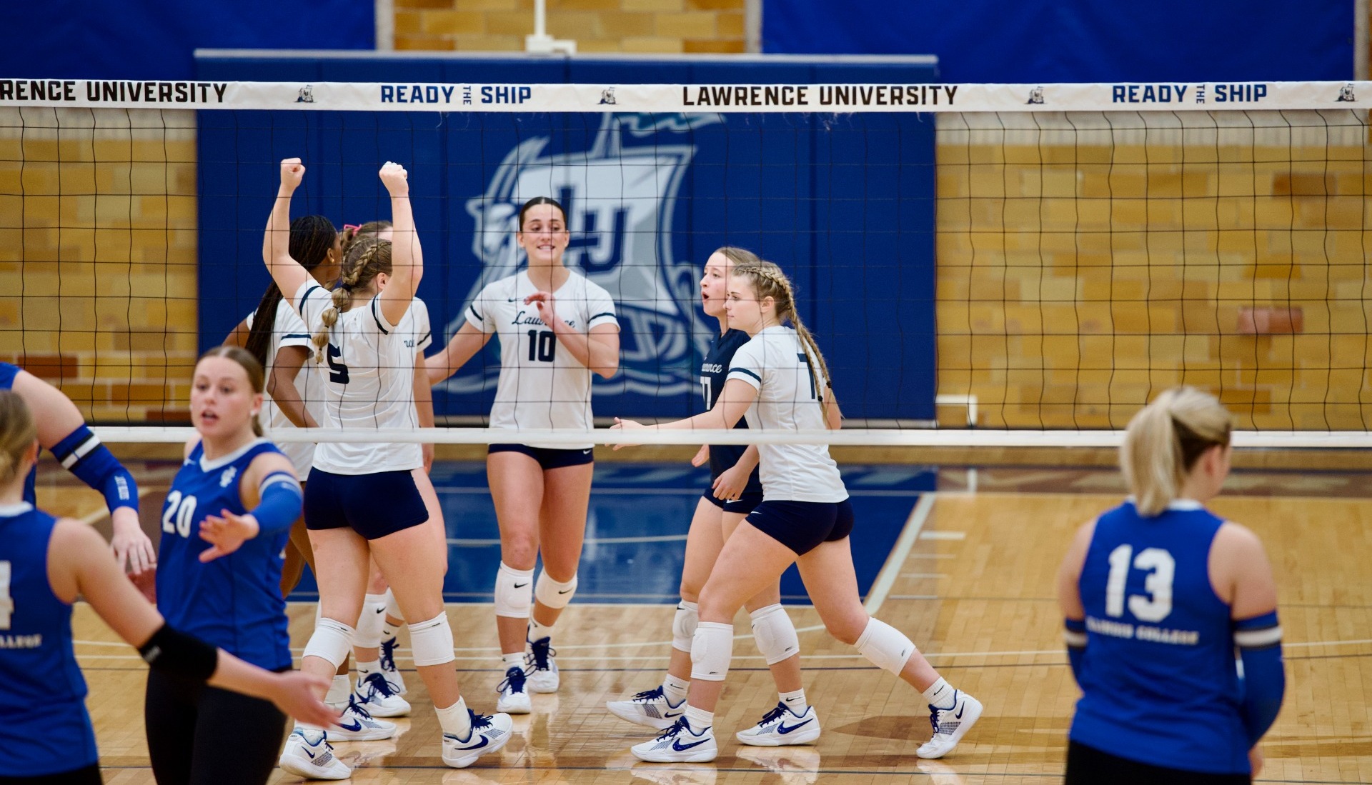 action shot of lawrence womens volleyball