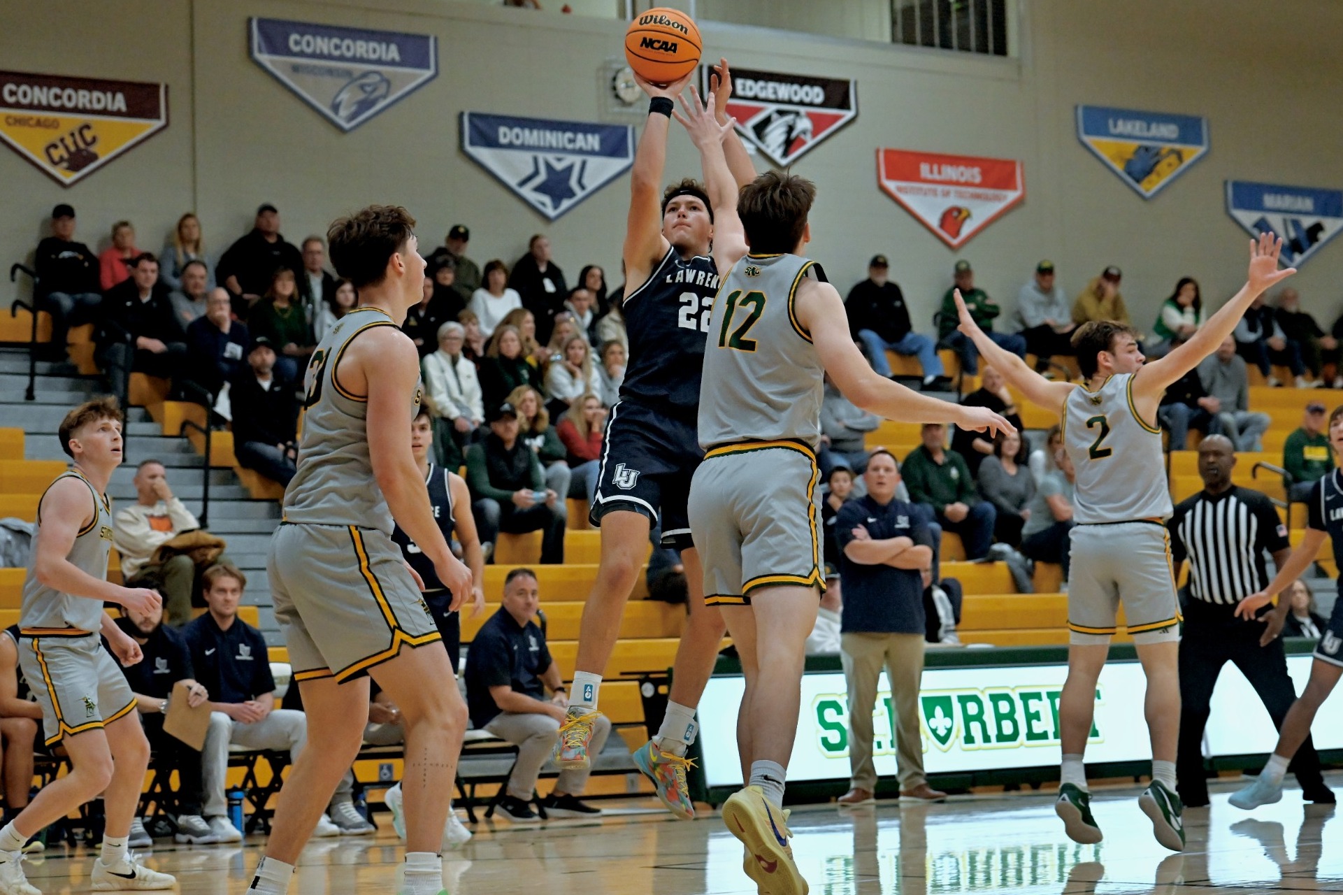 action shot of mens basktball forward Nic Guriotis 