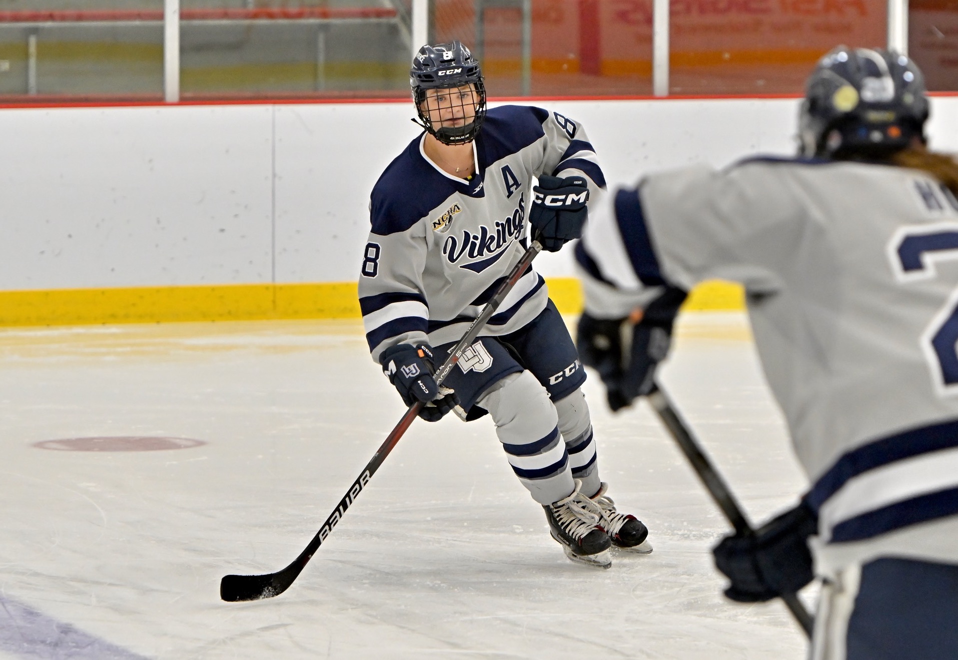 Lawrence women hockey action shot of Emma Perry 