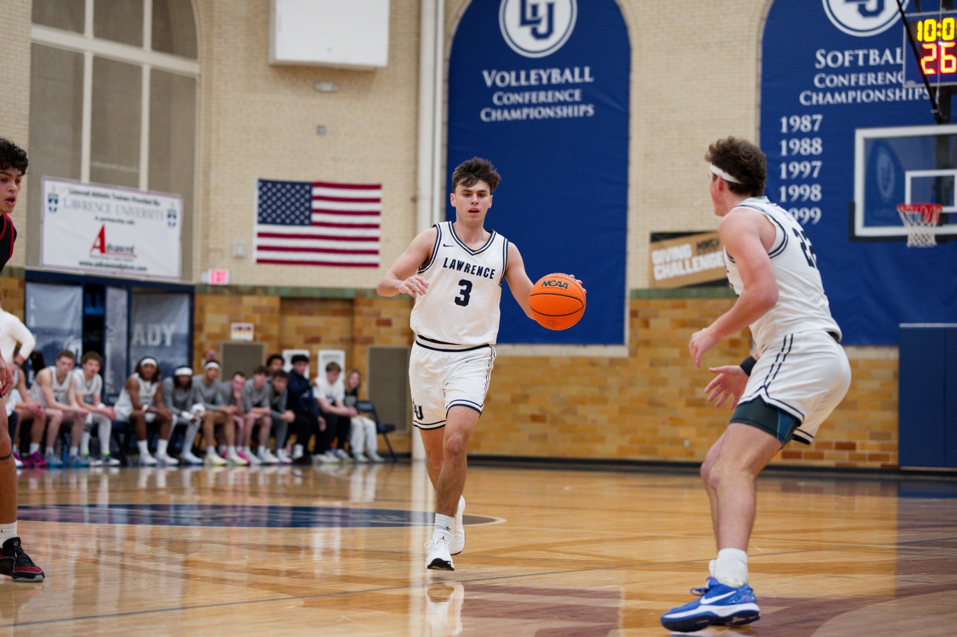 actionshot of nathan valentine and nic guriotis mens basketball