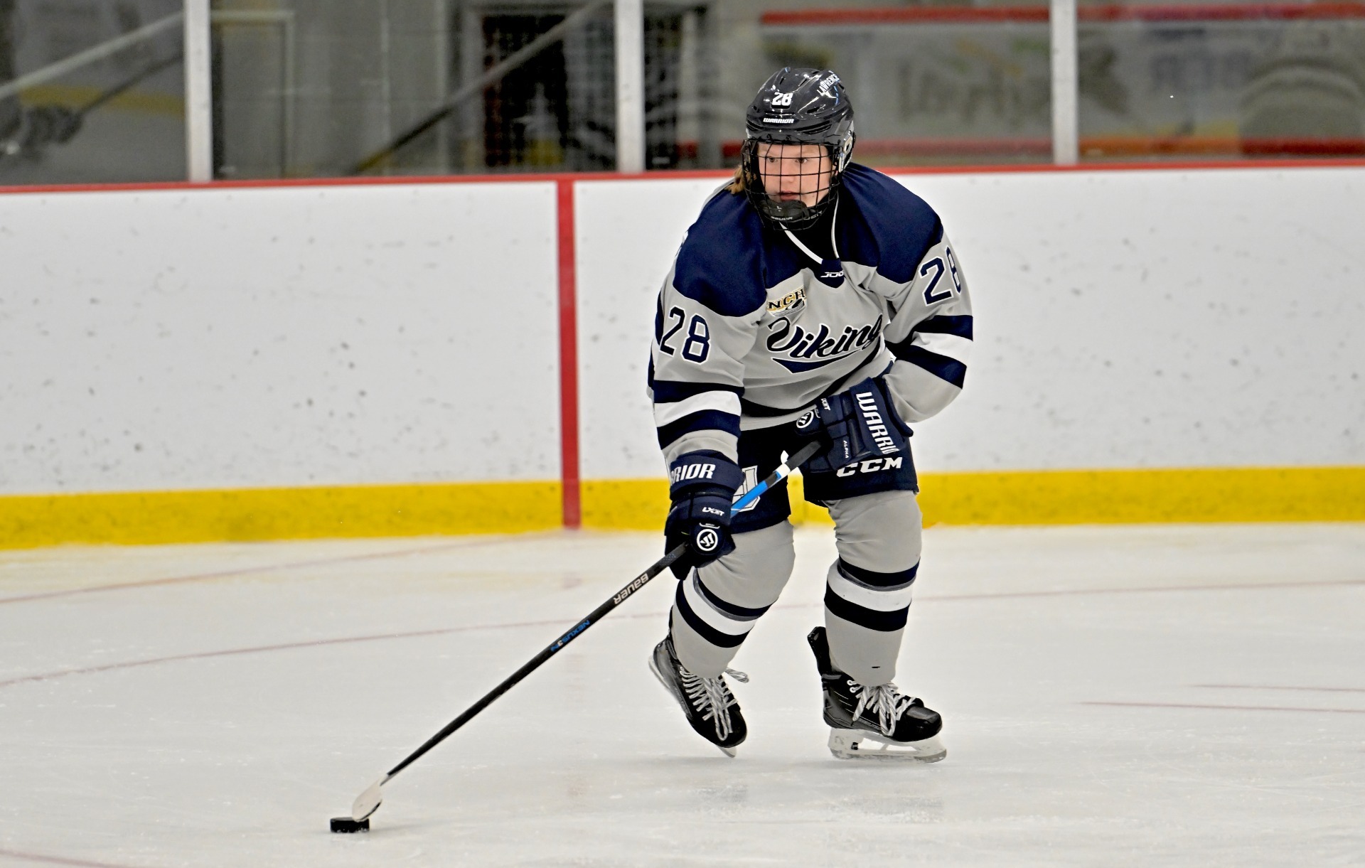 action shot of lawrence womens hockey emmerson berger 