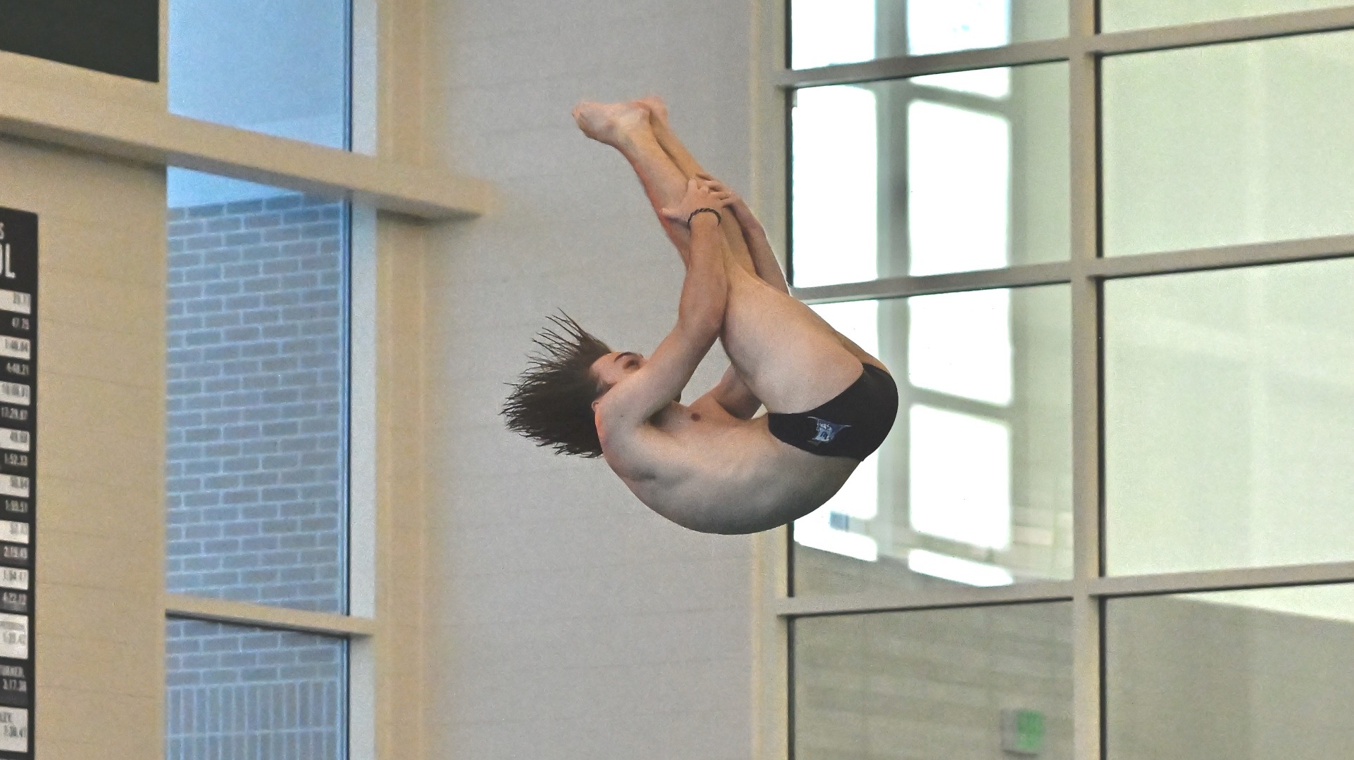 Lawrence men's diving action Jackson Bertman