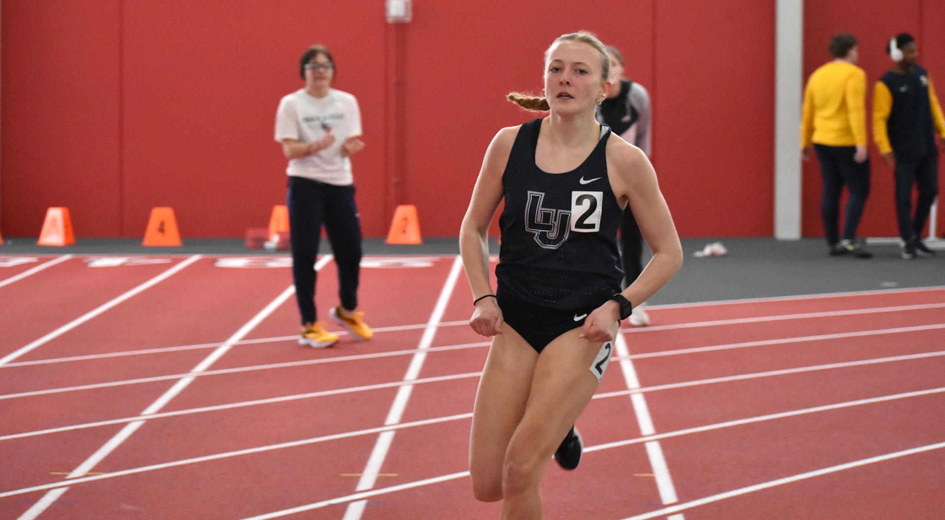 Lawrence University women's track action Mila Westra