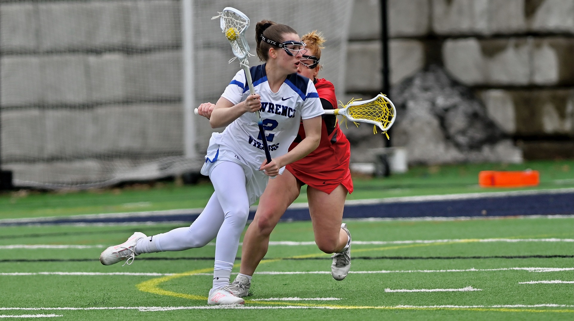 Lawrence women's lacrosse action Lydia Lueck