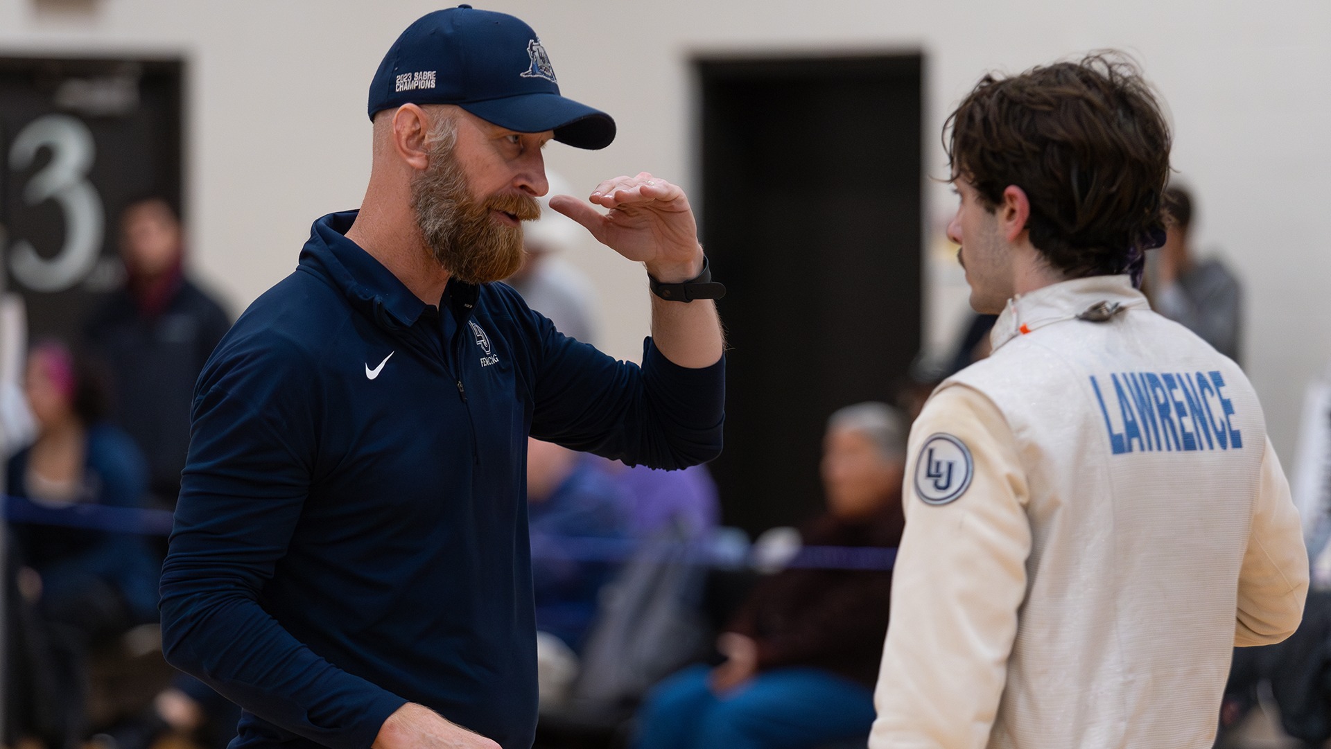 Lawrence fencing coach Eric Momberg action