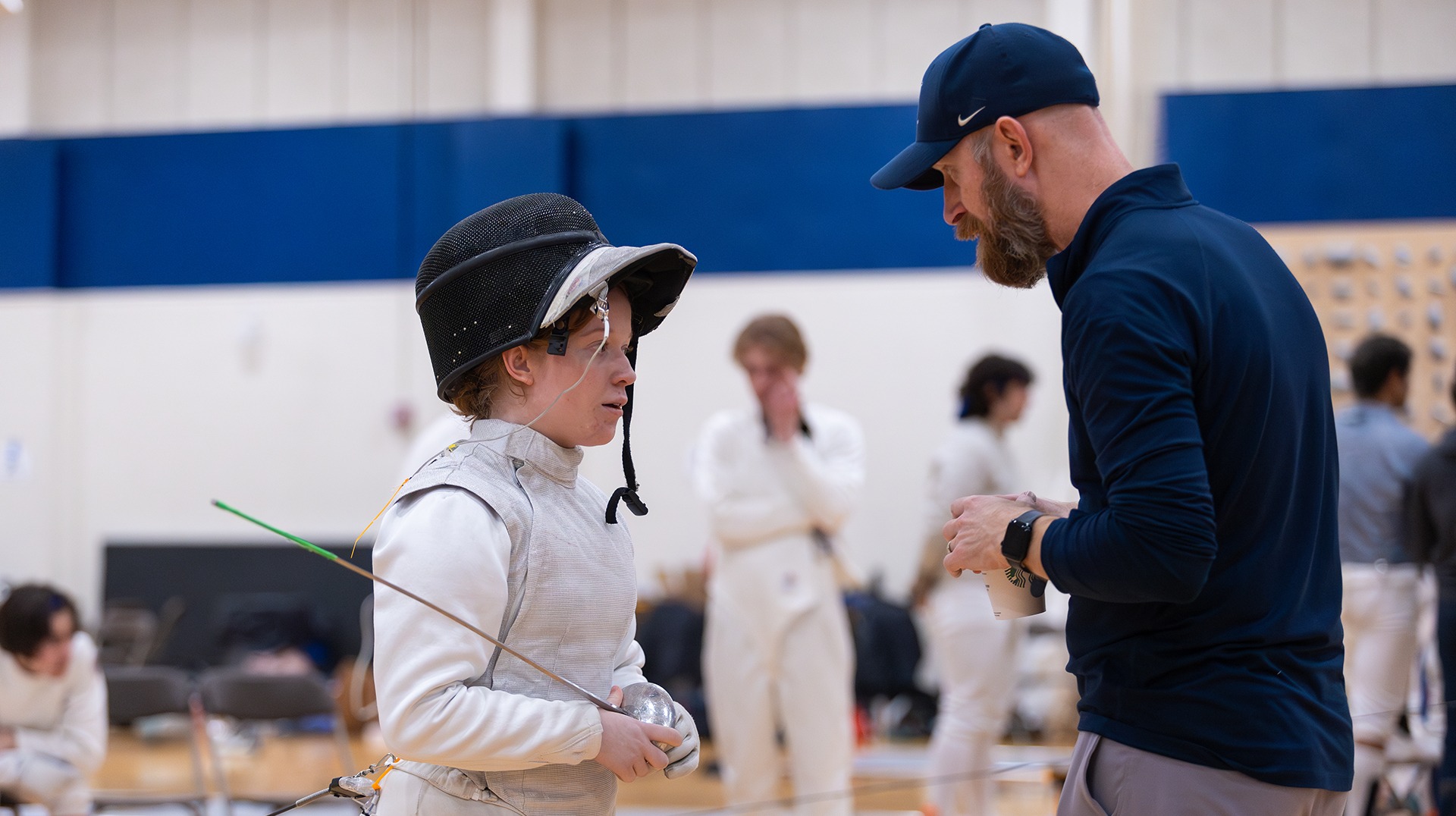 Lawrence fencing coach Eric Momberg action