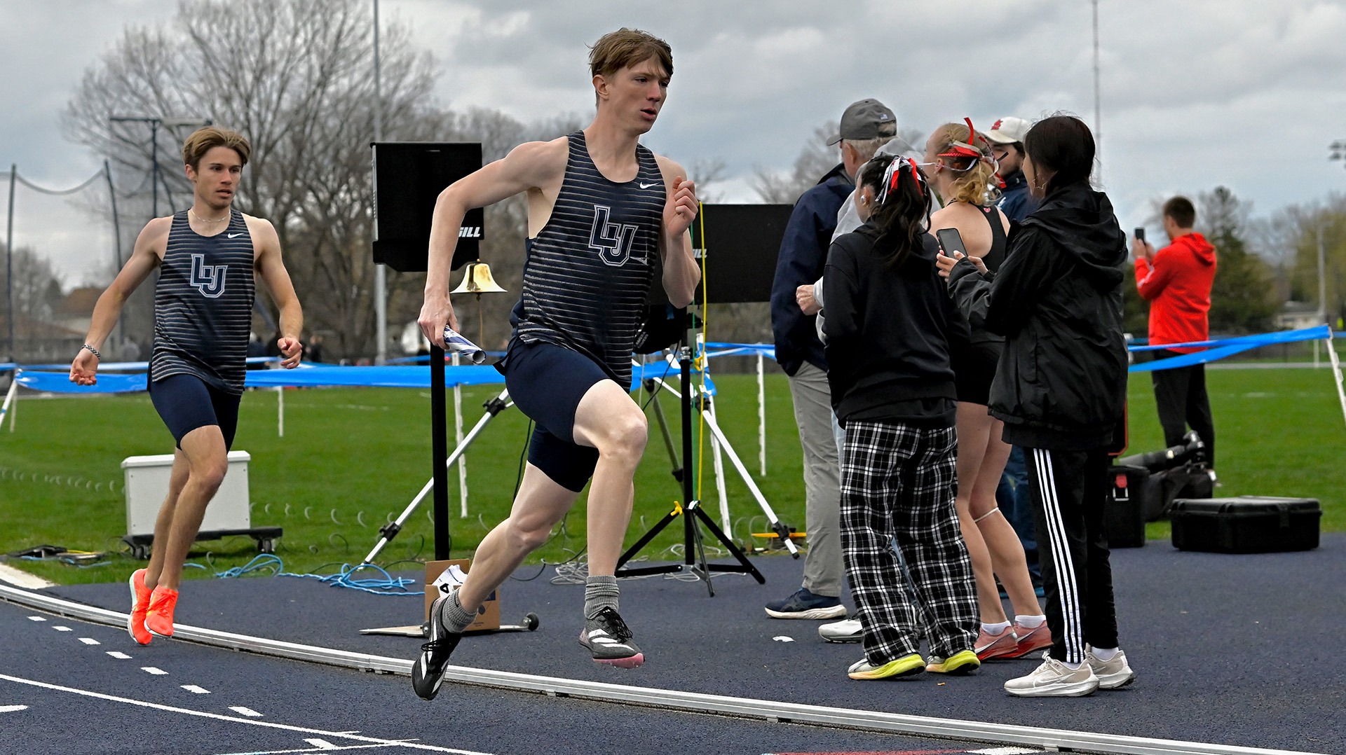 Lawrence men's track action Brendan Cross