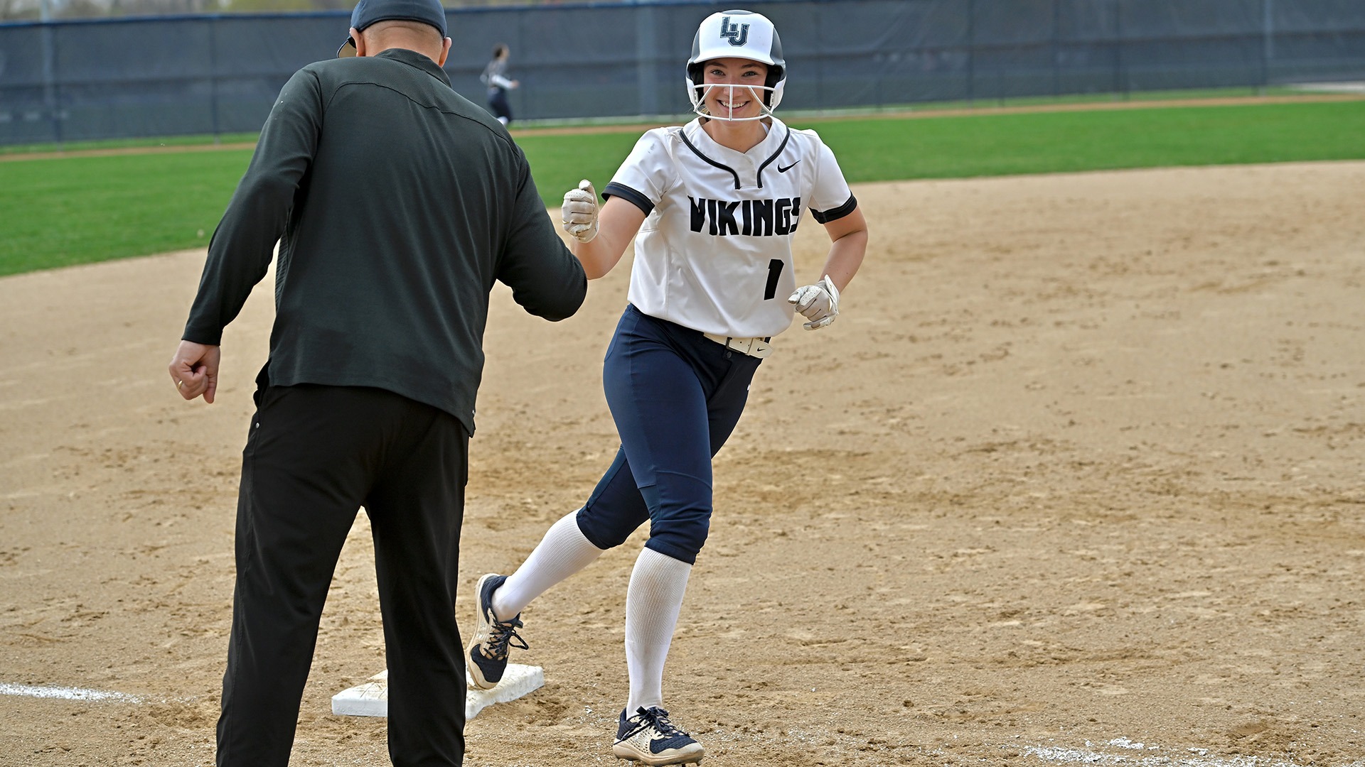 Lawrence softball action Mattigan Haller