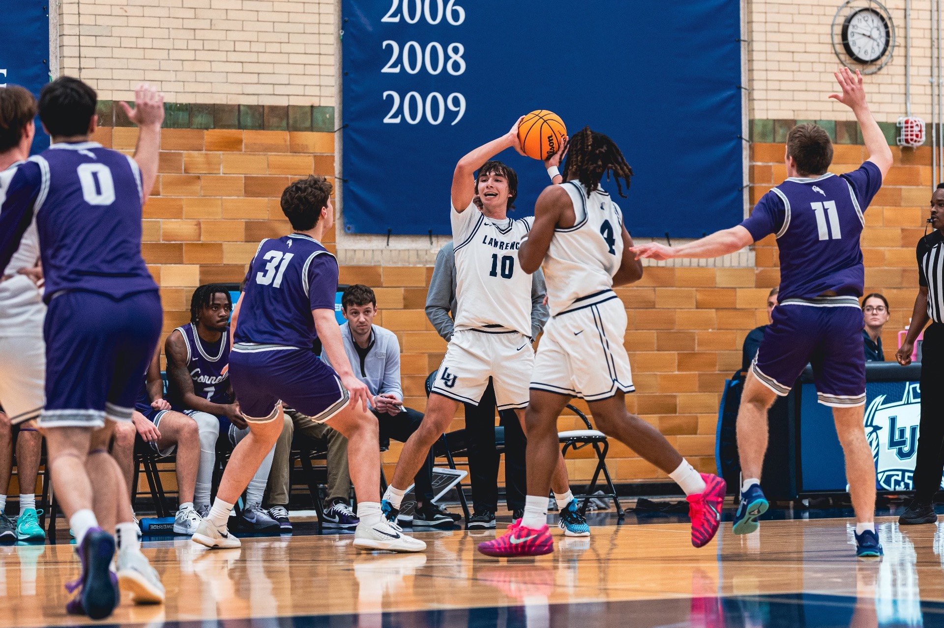 action shot of mens basktball hogan Demovsky 