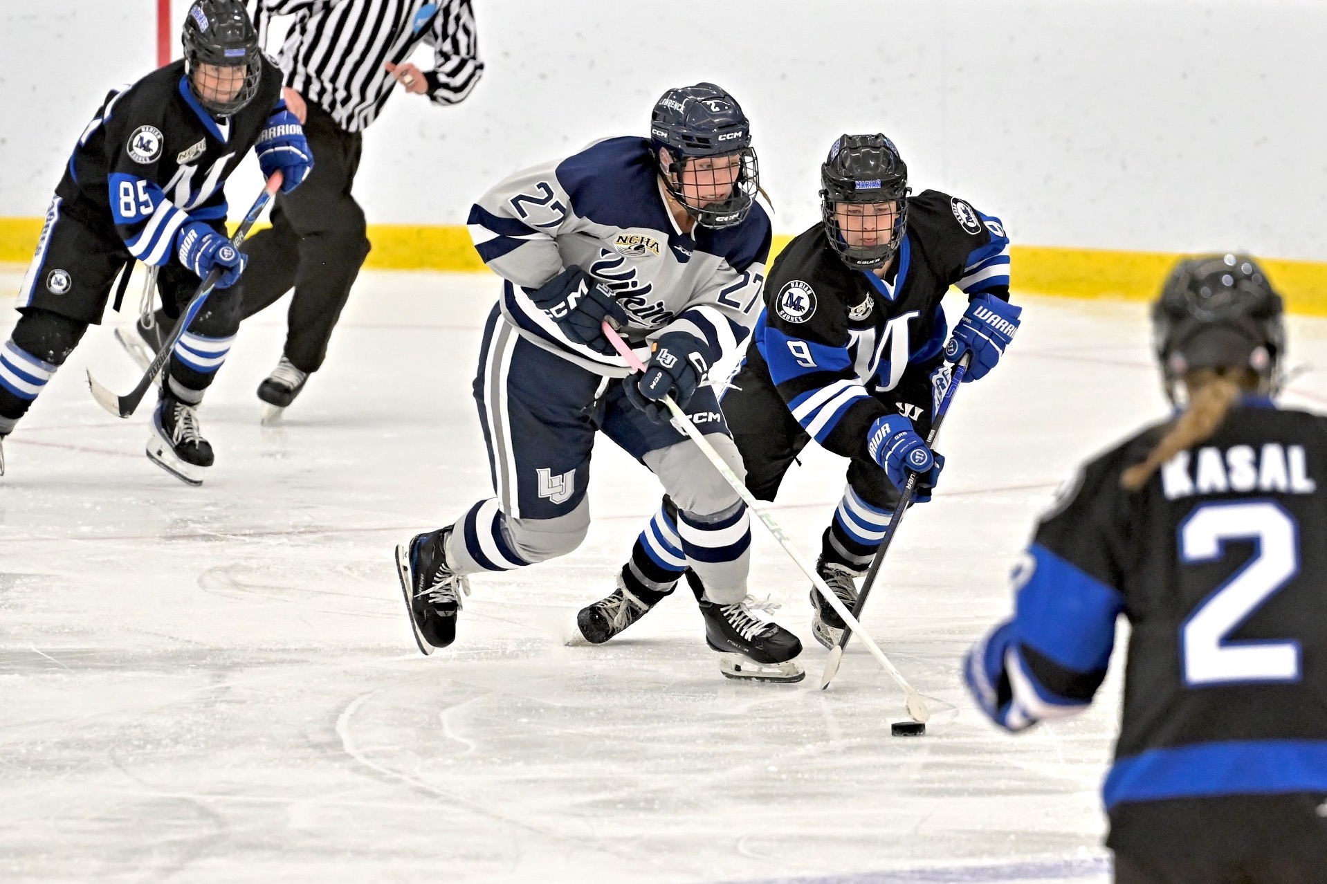 action shot of womens hockey player Reese Delbert