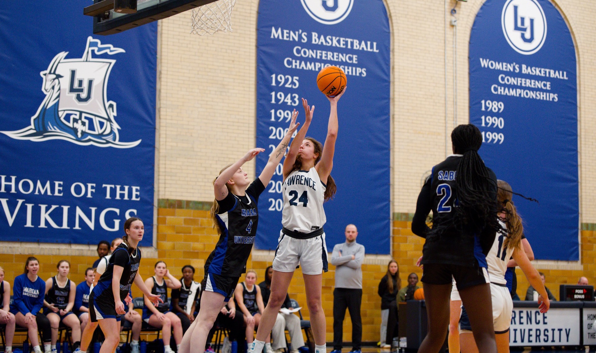 action shot of womens basketball Sophie Morey 