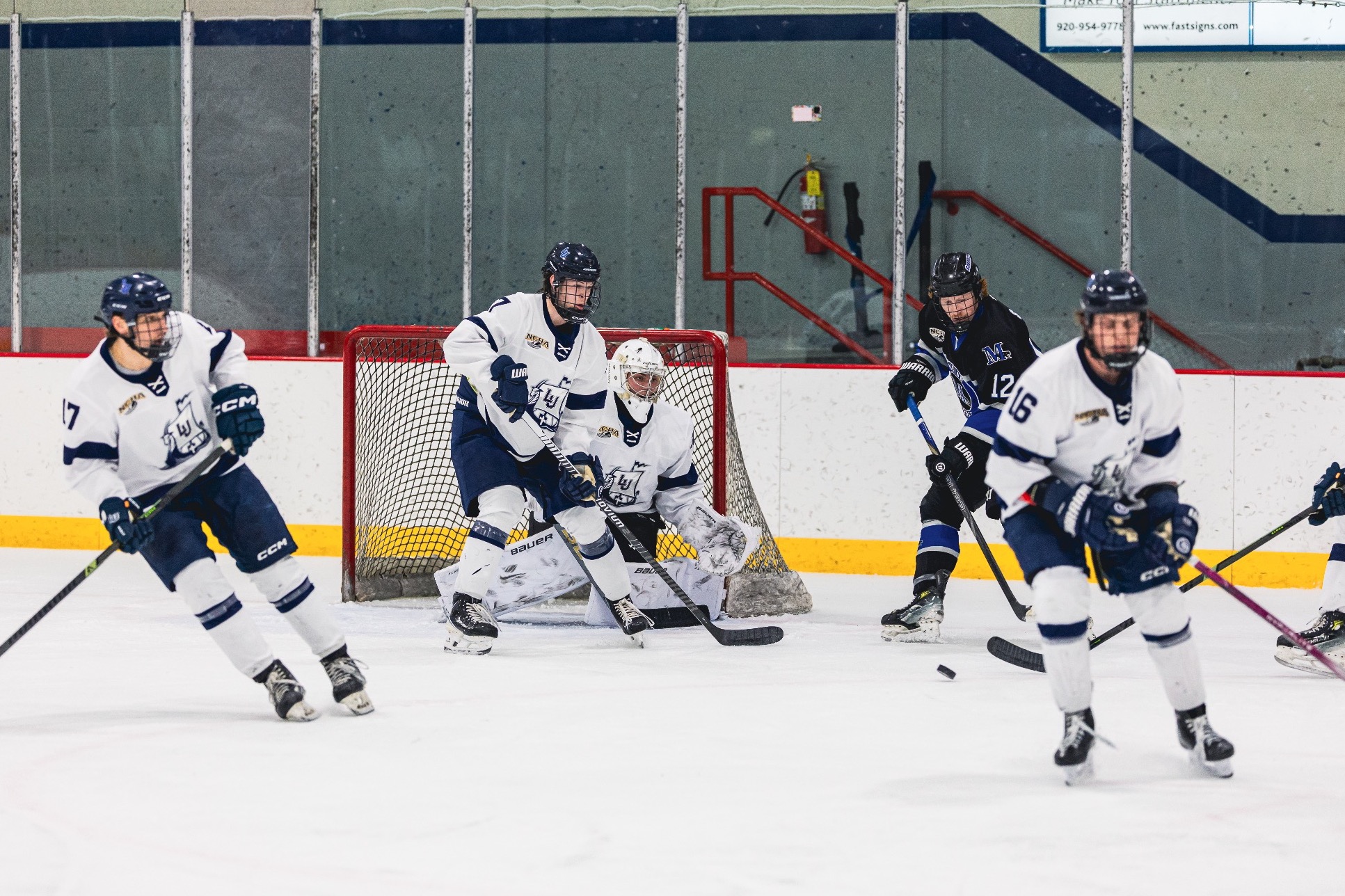 mens hockey group action shot 