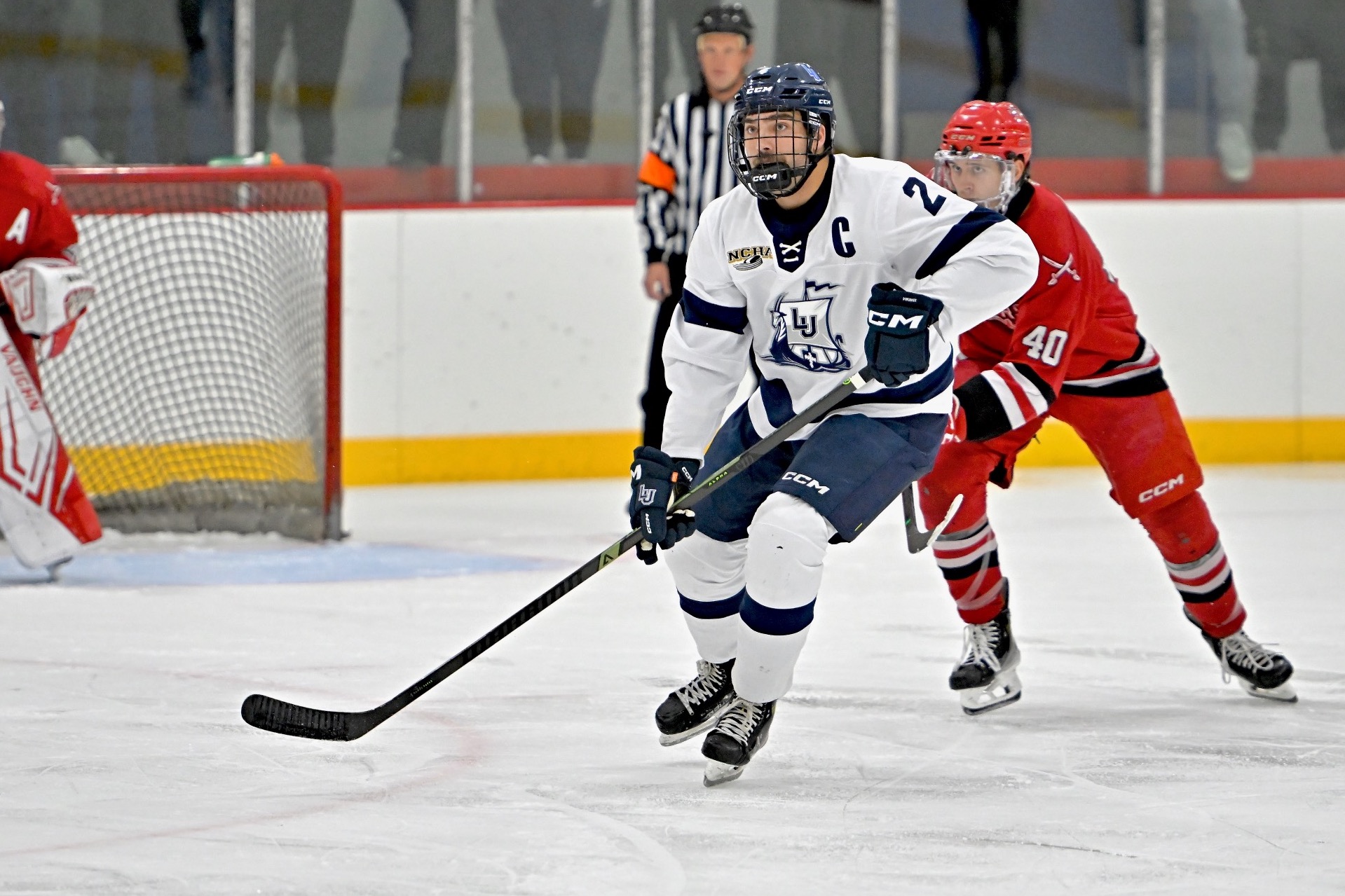 action shot of mens hockey Jayden Jensen 