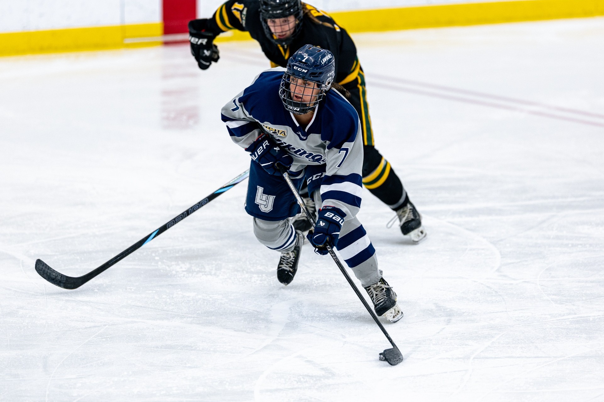 action shot of lu womens hockey kate 