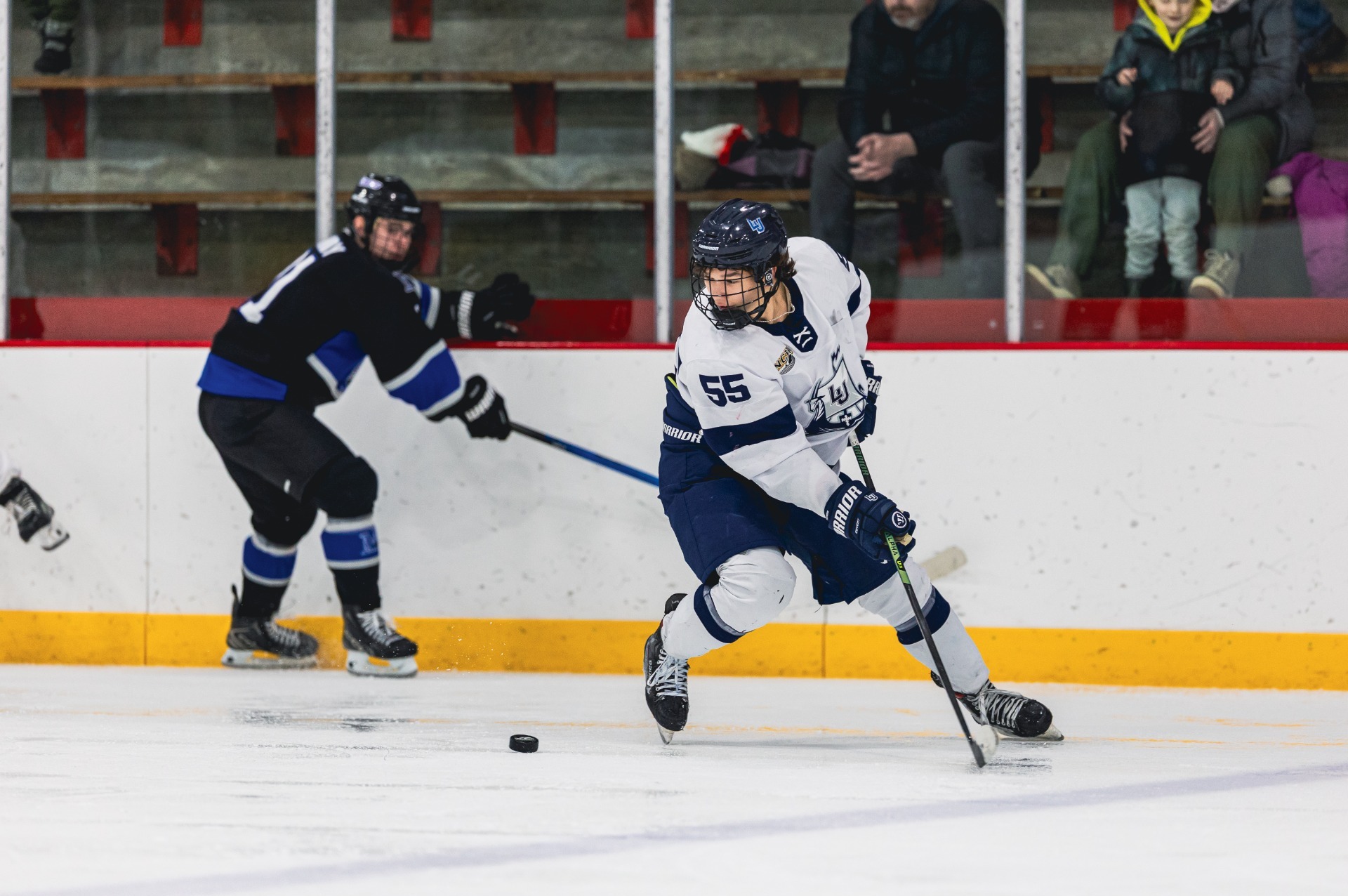 action shot of mens hockey ethan johnson 