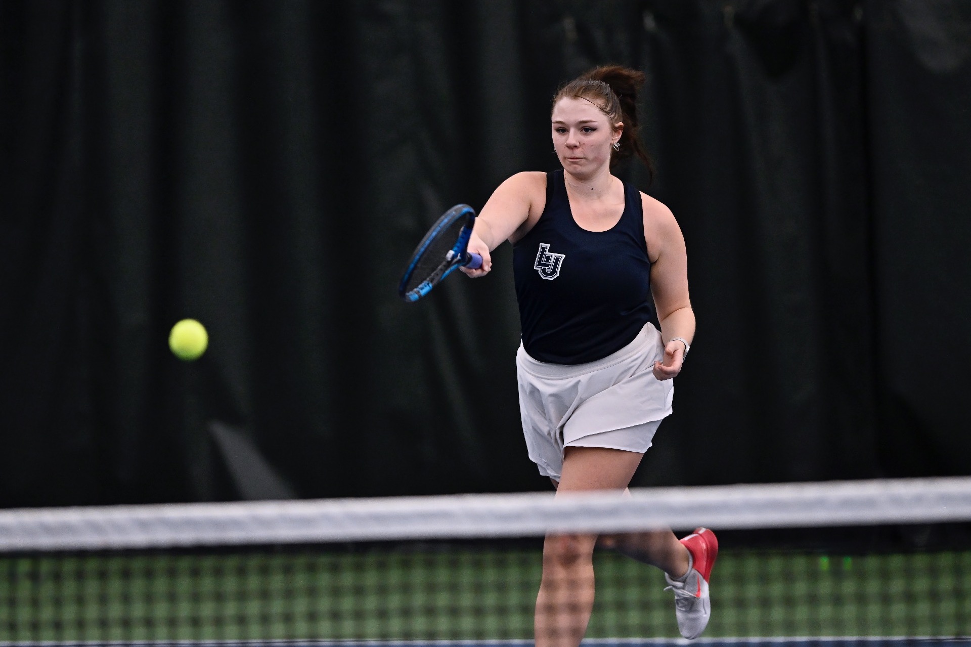 Maddie action shot of womens tennis 