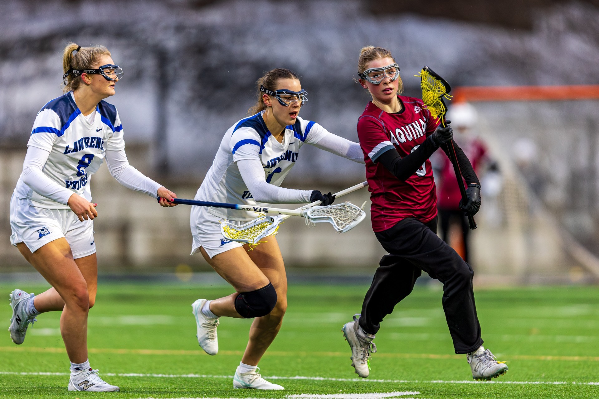 action shot of womens lax