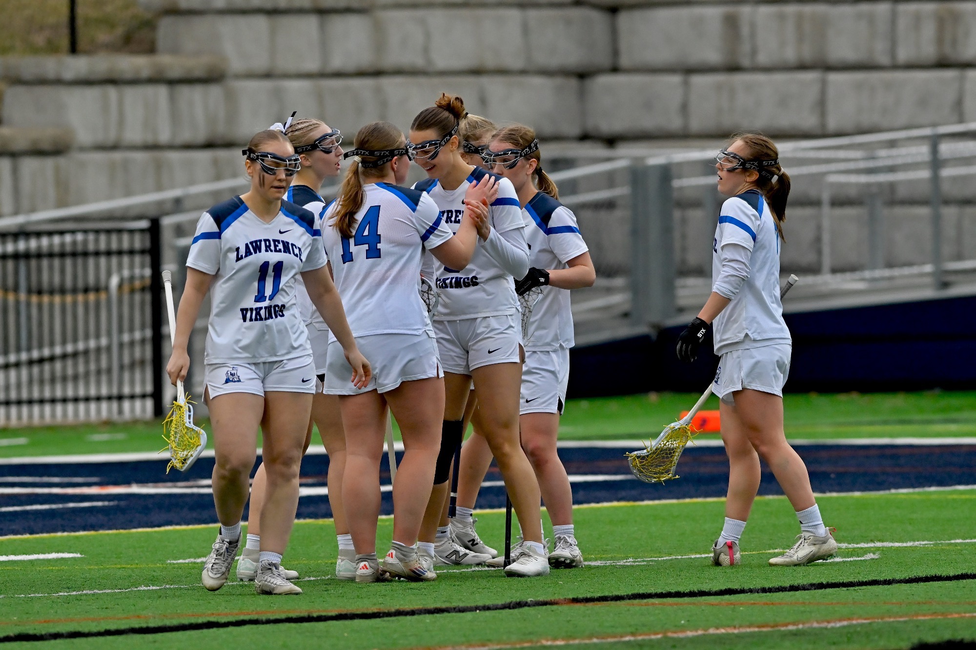 action shot of womens lacrosse celebration 