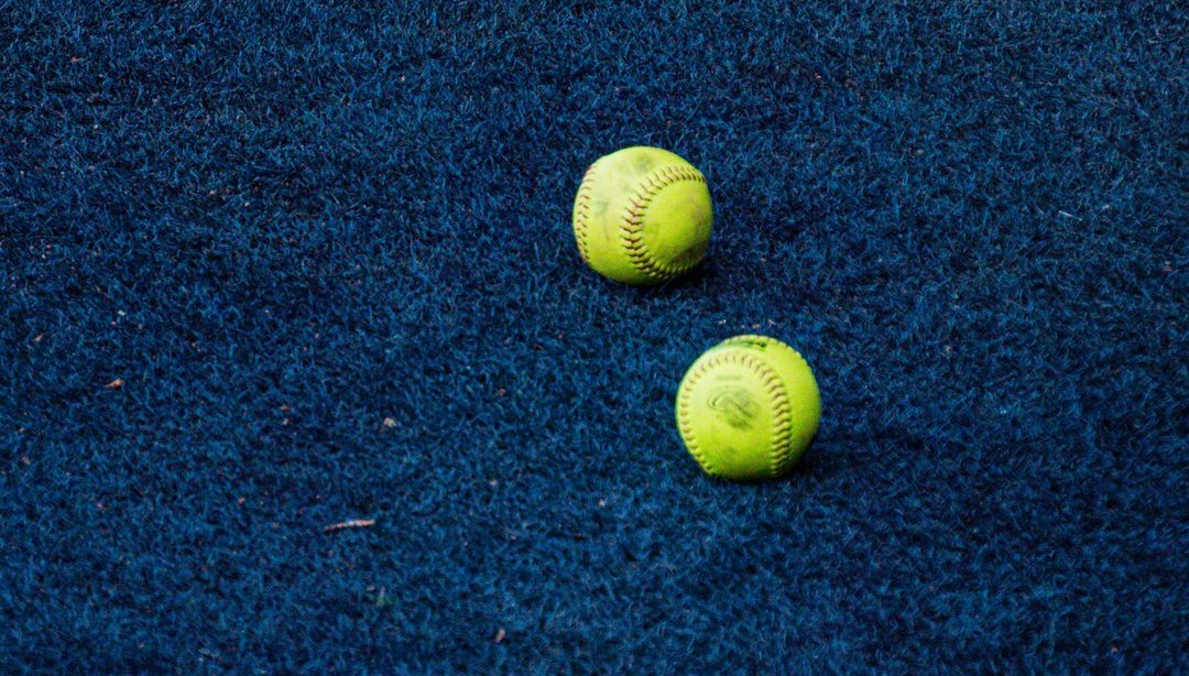 Two Softballs on the Warning Track