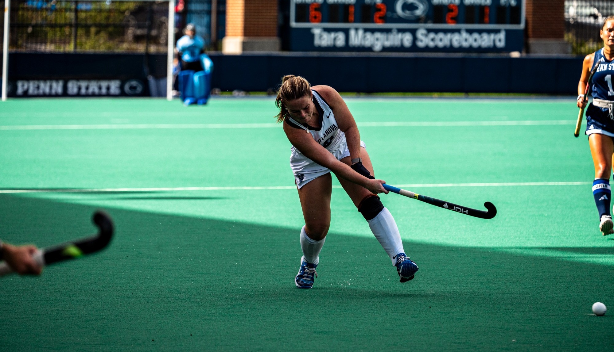 Addie Froehlich slaps the Ball towards teammate