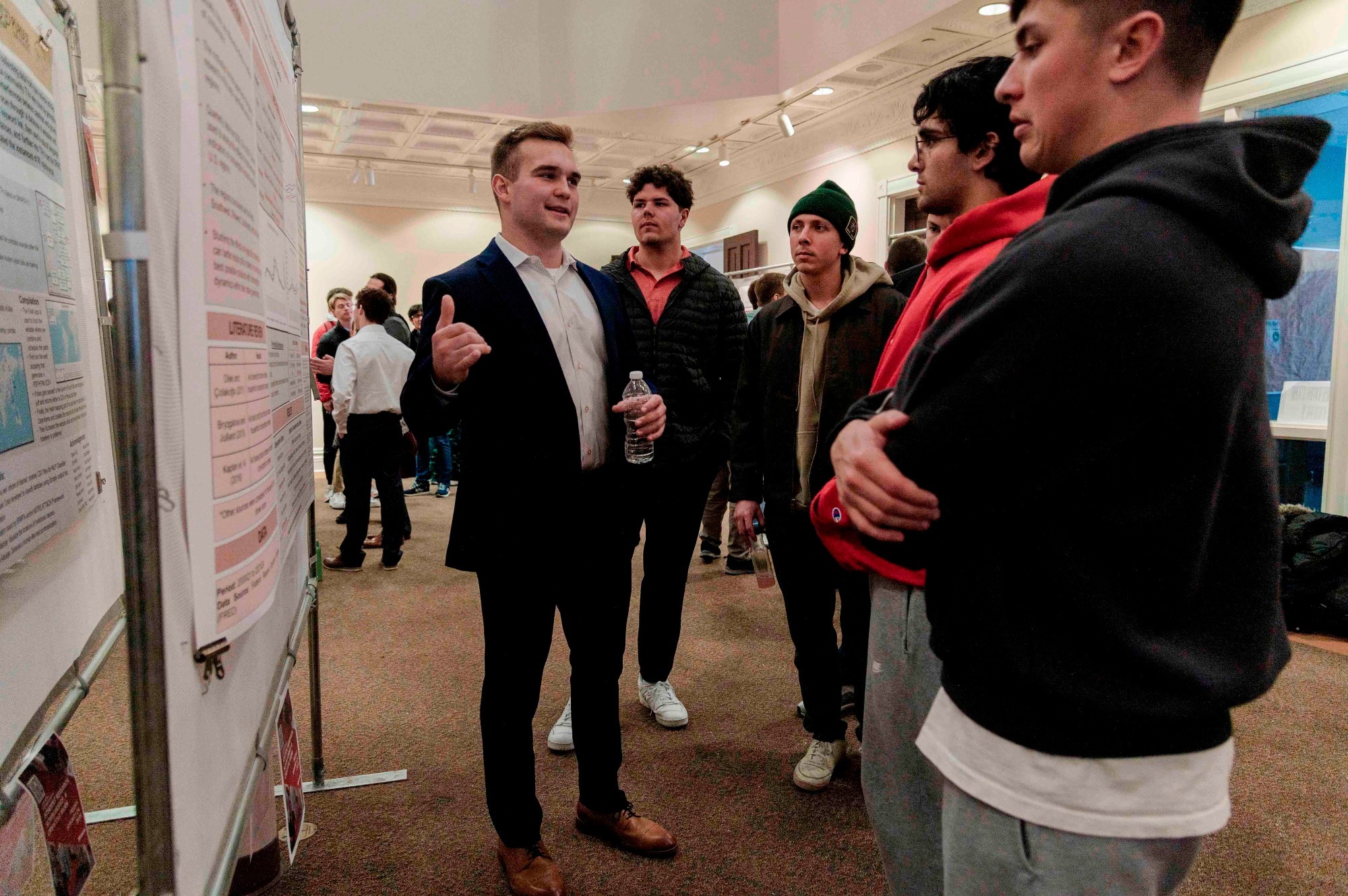 Wabash College student and football player Owen Volk discusses his project at the College's annual Celebration of Student Research, Scholarship, and Creative Work