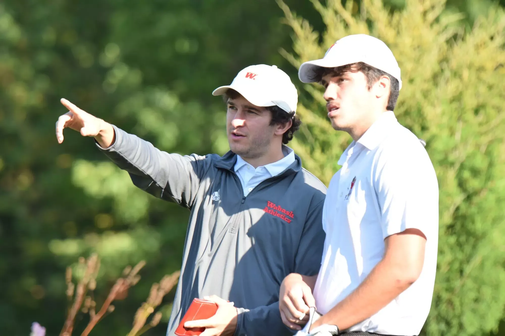 Wabash College head golf coach Justin Kopp with a Little Giant player