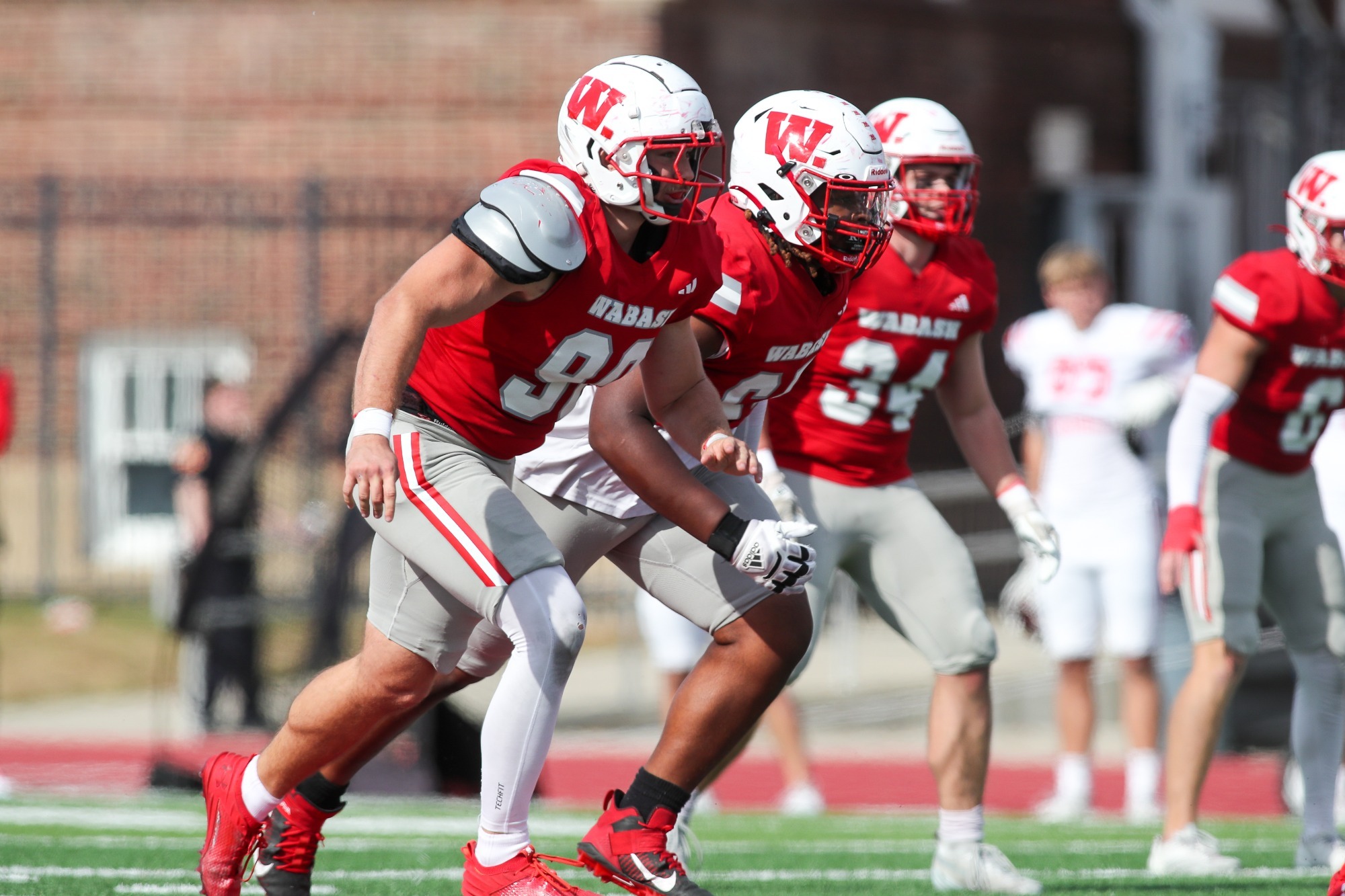 Wabash College defenders prepare to rush the passer.