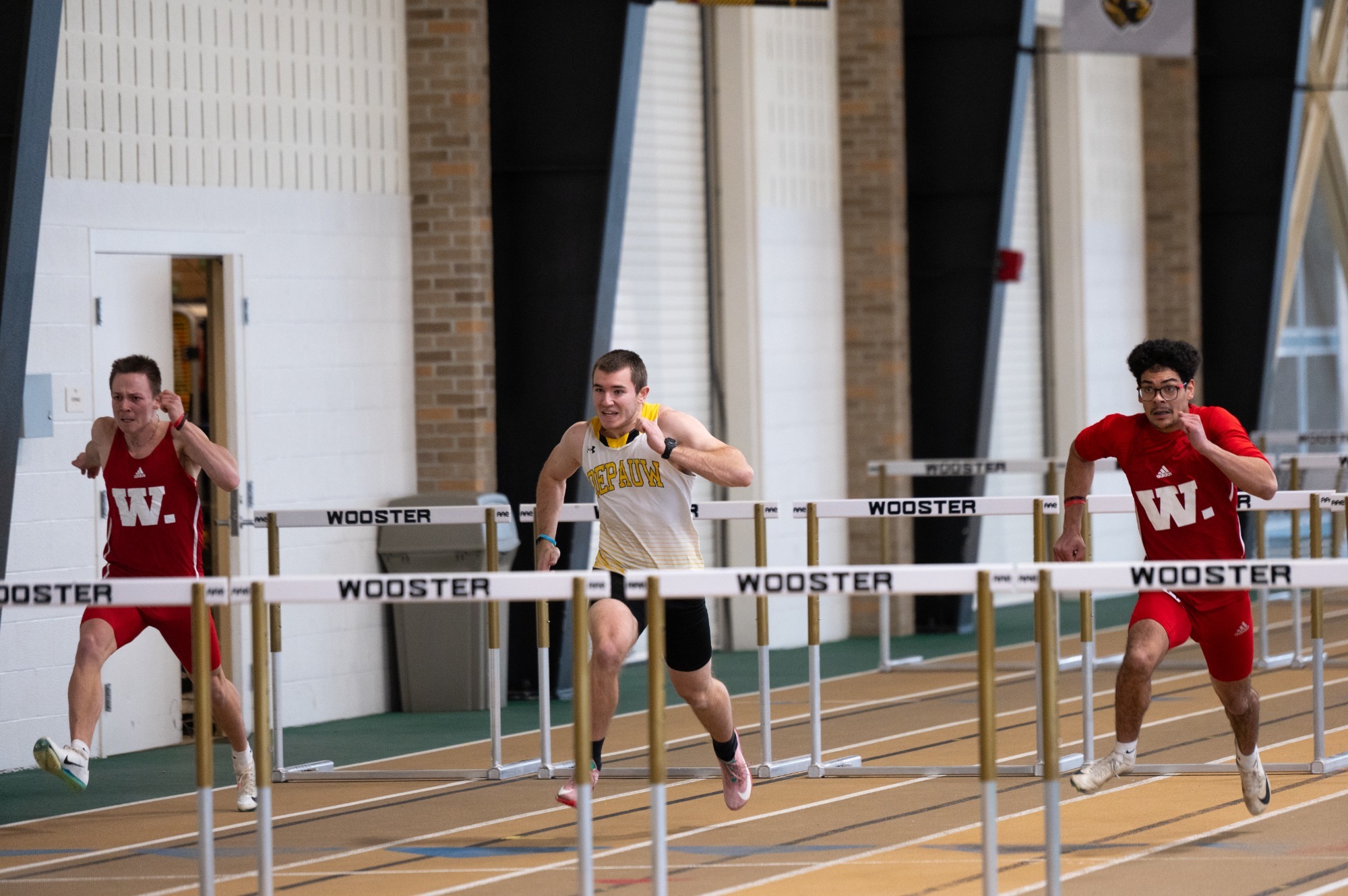 Tyler Petroski and Ricky Sanders compete in the 60-meter hurdles at the NCAC Heptathlon