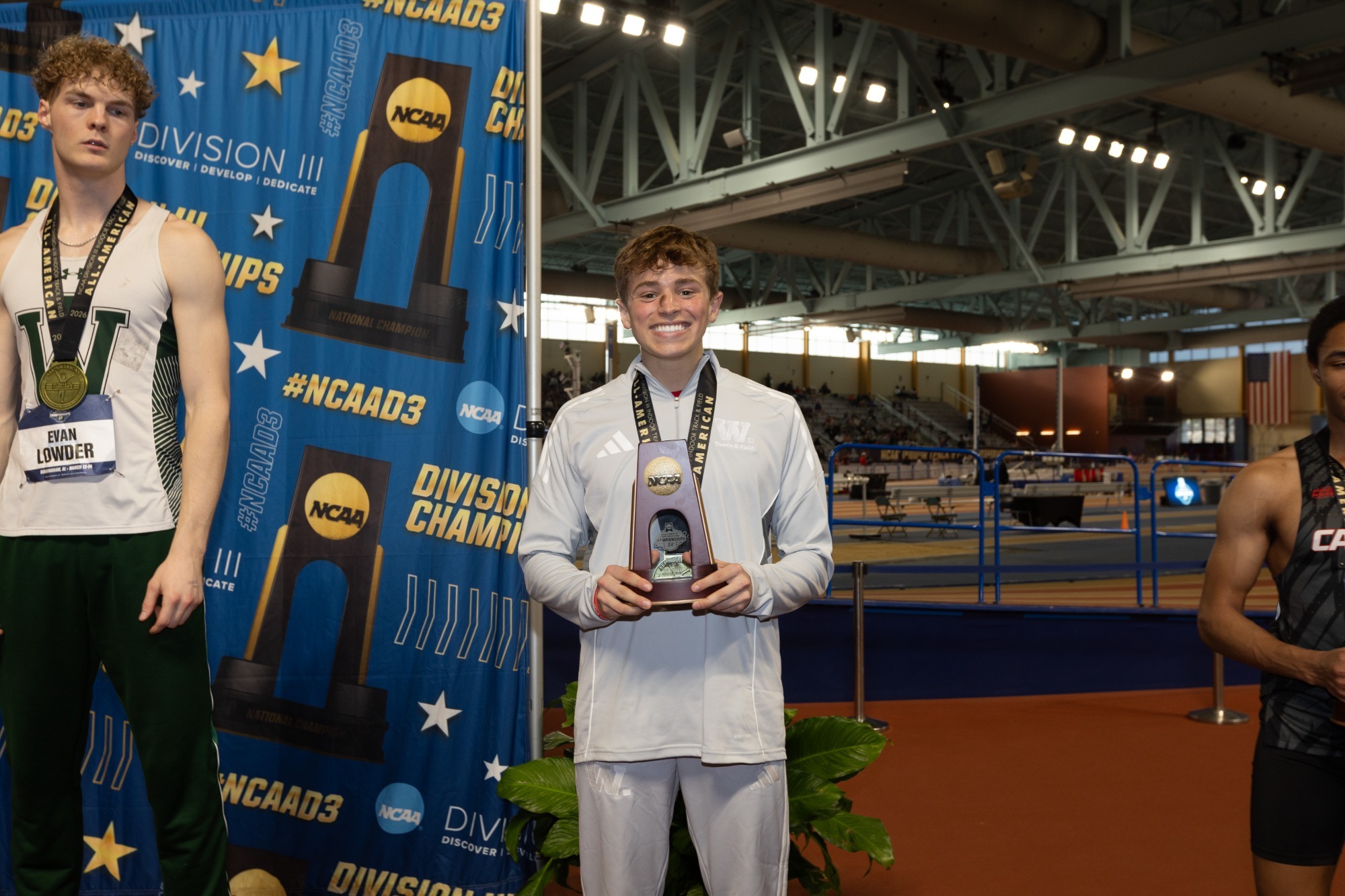Brock DeBello holds his NCAA trophy after finishing in sixth place in the 400-meter run at the 2026 NCAA DIII Indoor Track and Field Championships