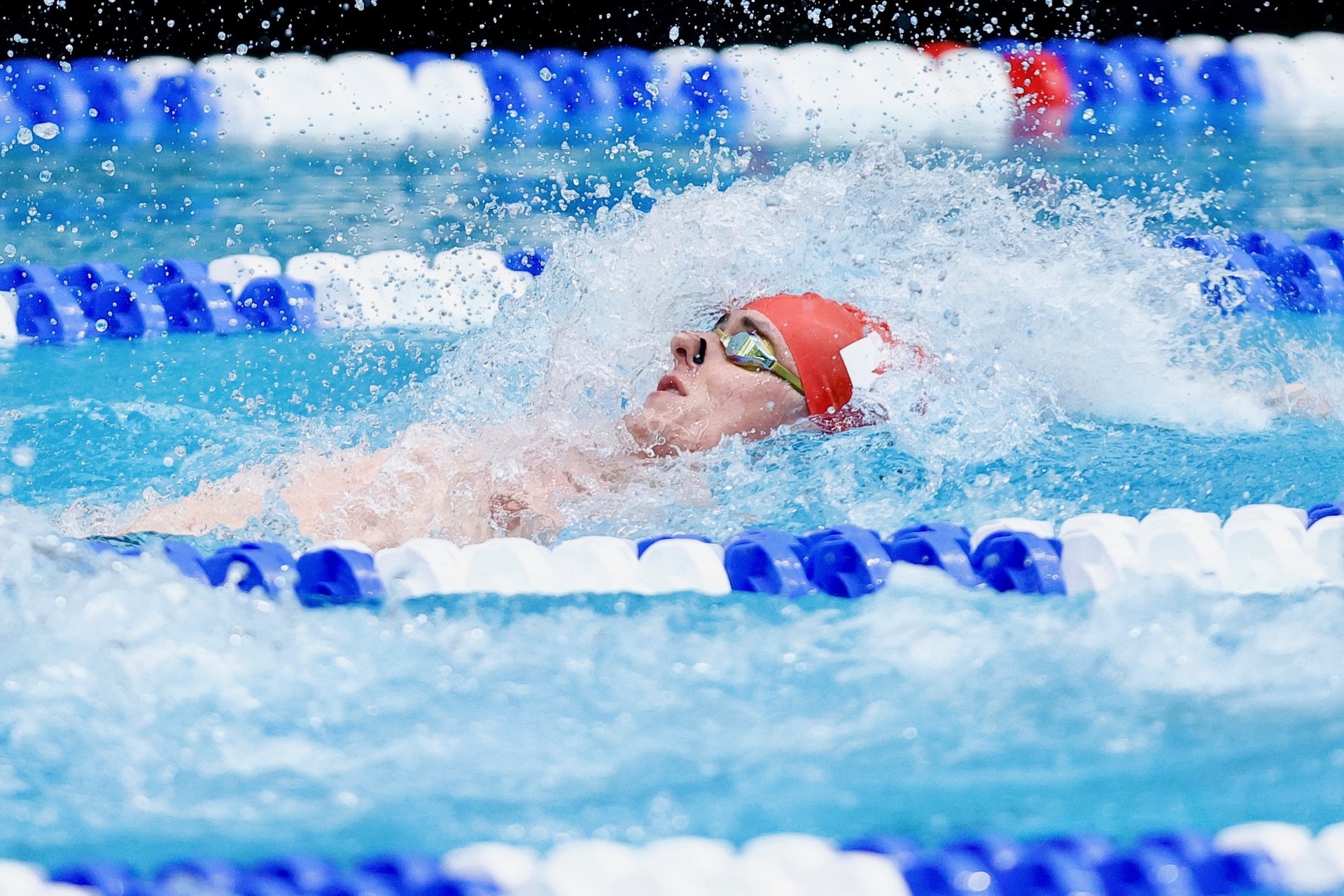 Ryan West competes in the 100-yard backstroke at the 2026 NCAA DIII Swimming and Diving Championships