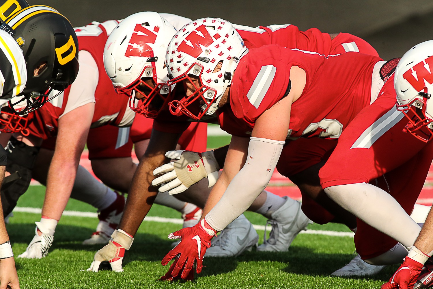 The Wabash College offensive line prior to the snap during the 131st Monon Bell Classic