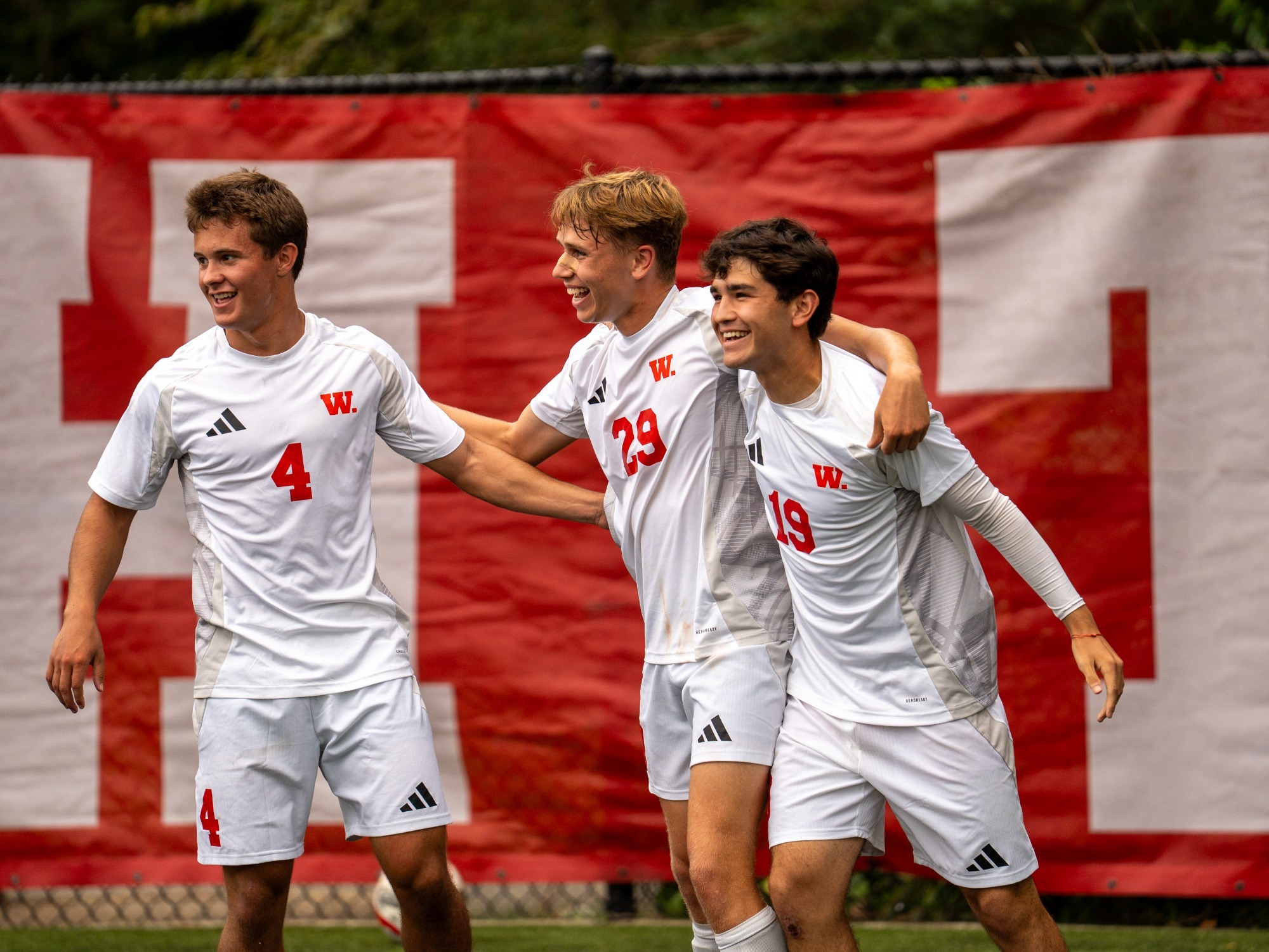 Gavin Glackman celebrates with Blake Horn and Sebastian Licon
