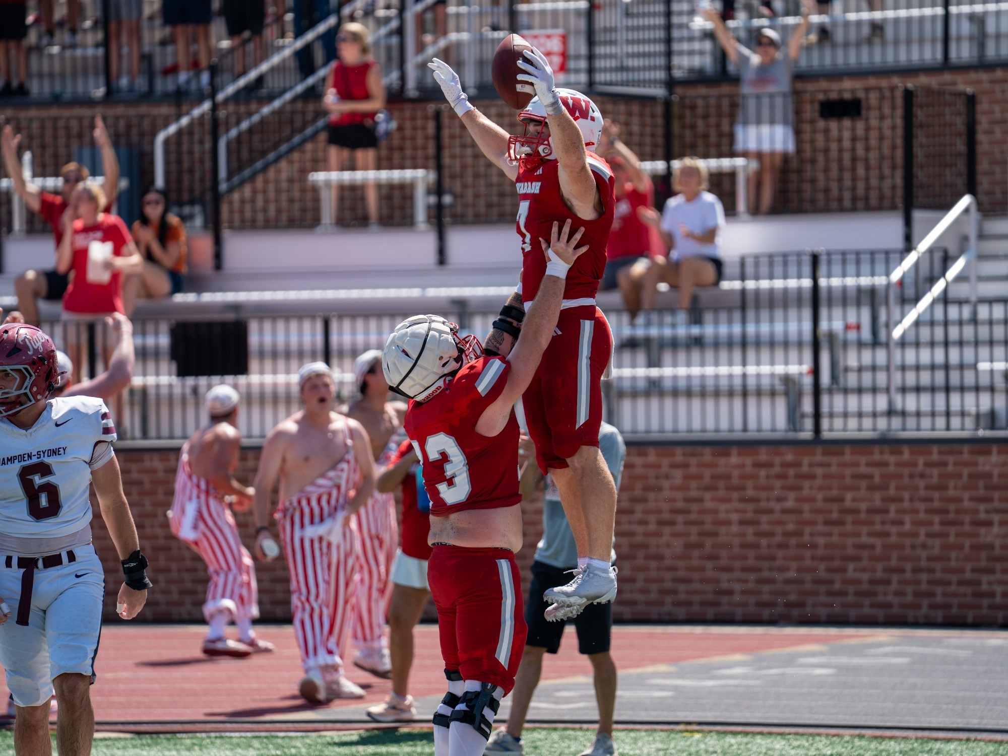 Wabash College football players celebrate a touchdown in a win over Hampden-Sydney in the 2026 Gentlemen's Classic